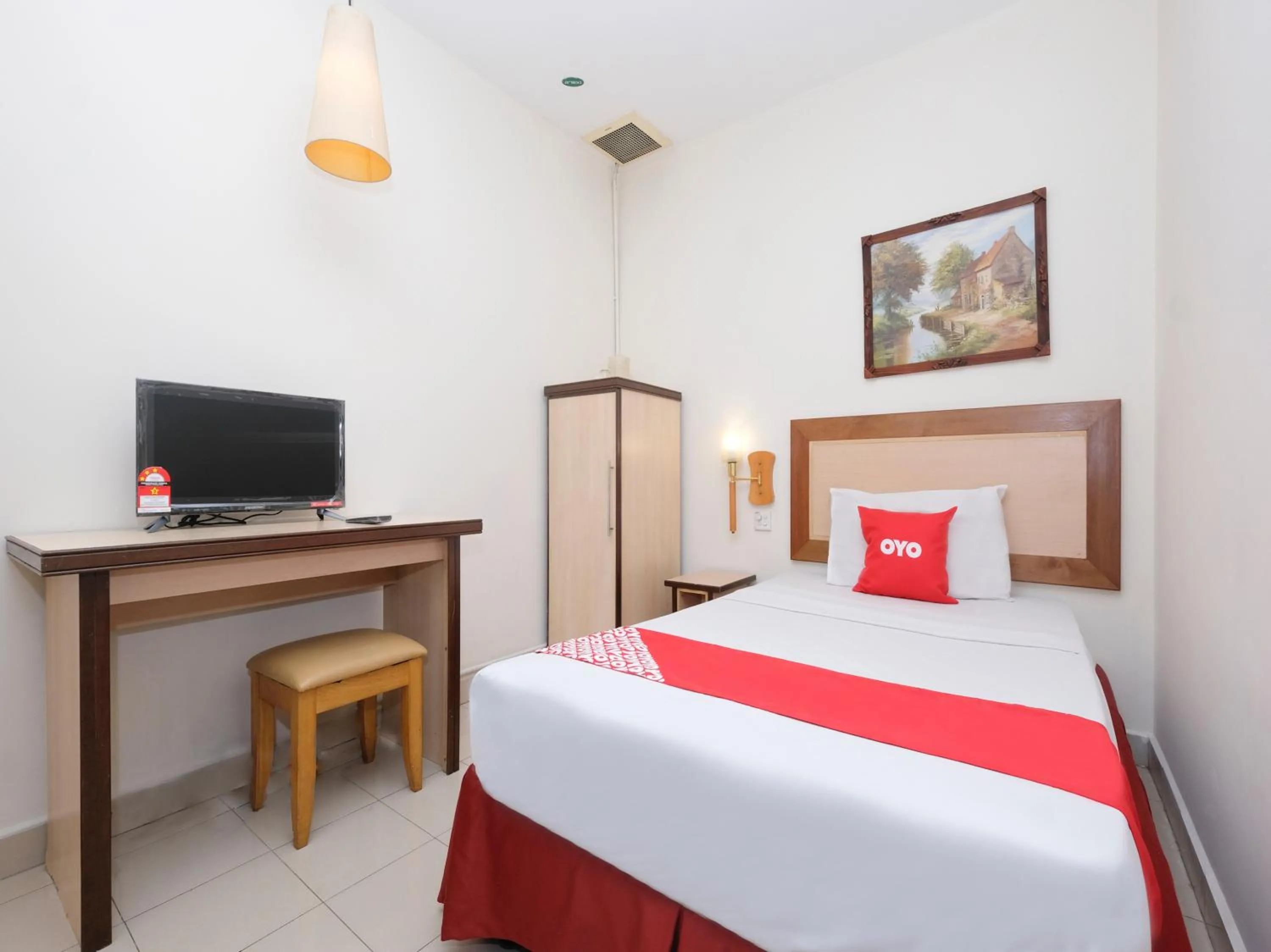 Bedroom in OYO 89968 Sri Sutra Hotel