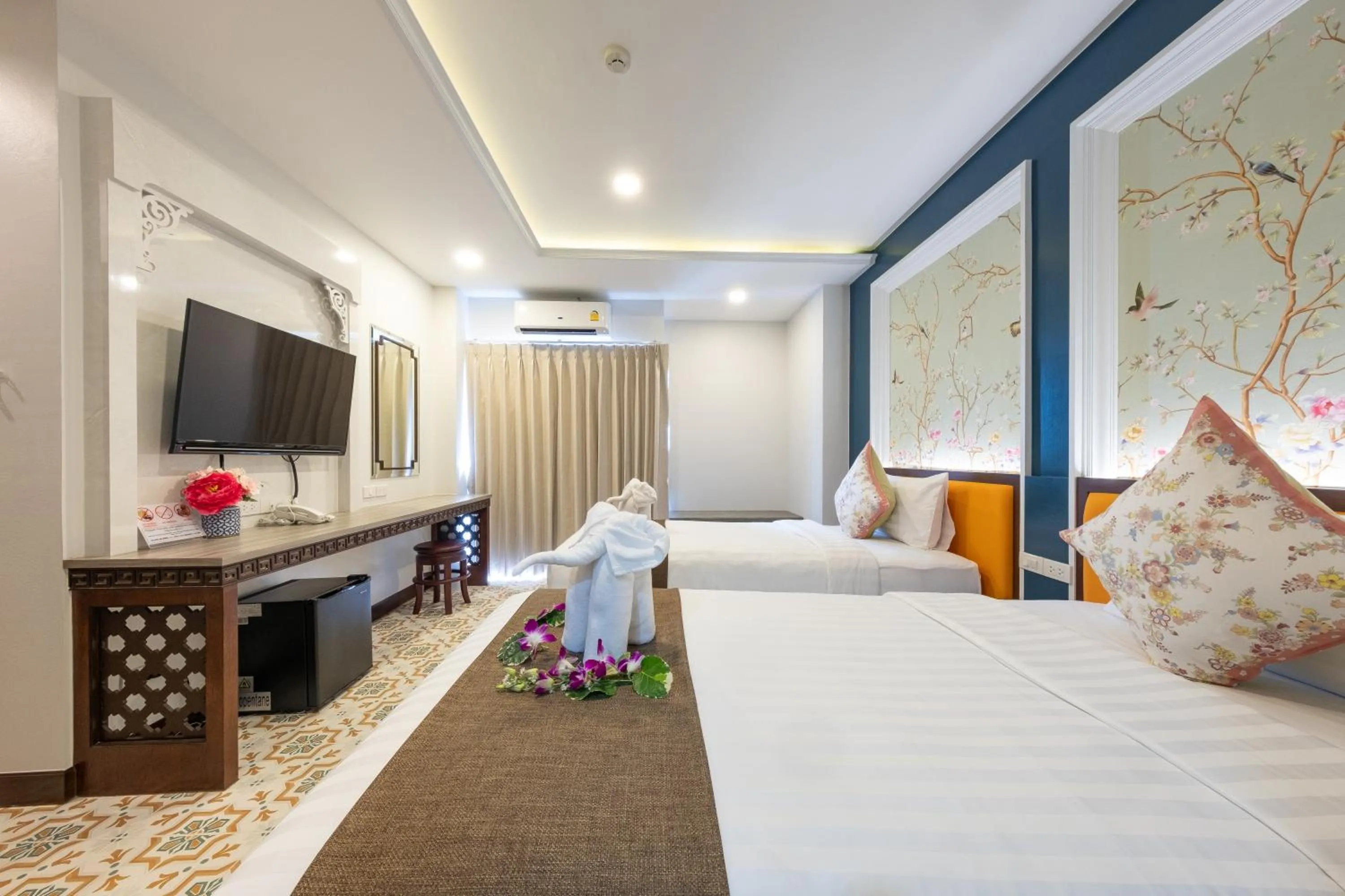 Bed in Sino Siam Hotel