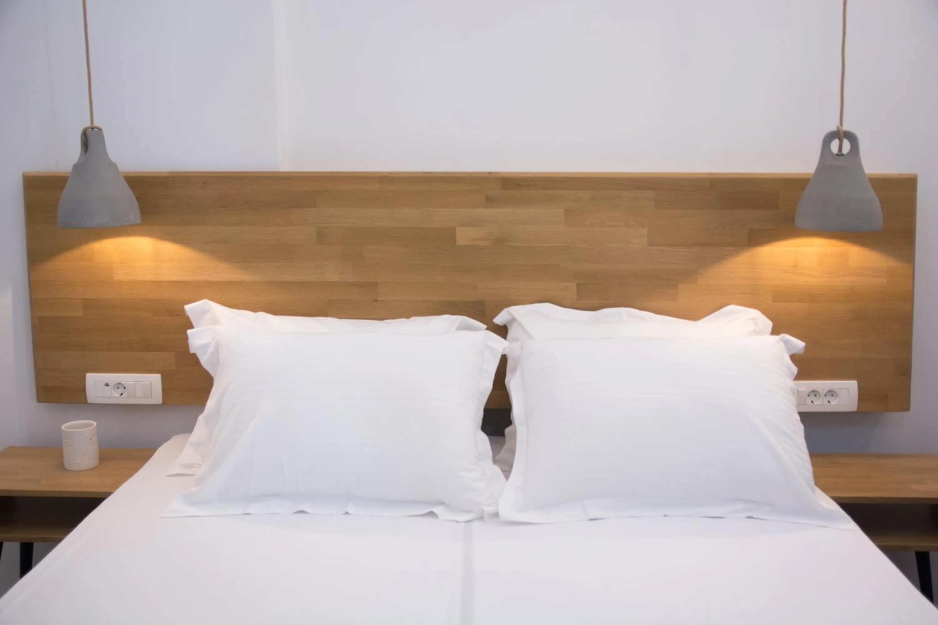 Bed in Amphitrite Suites Santorini