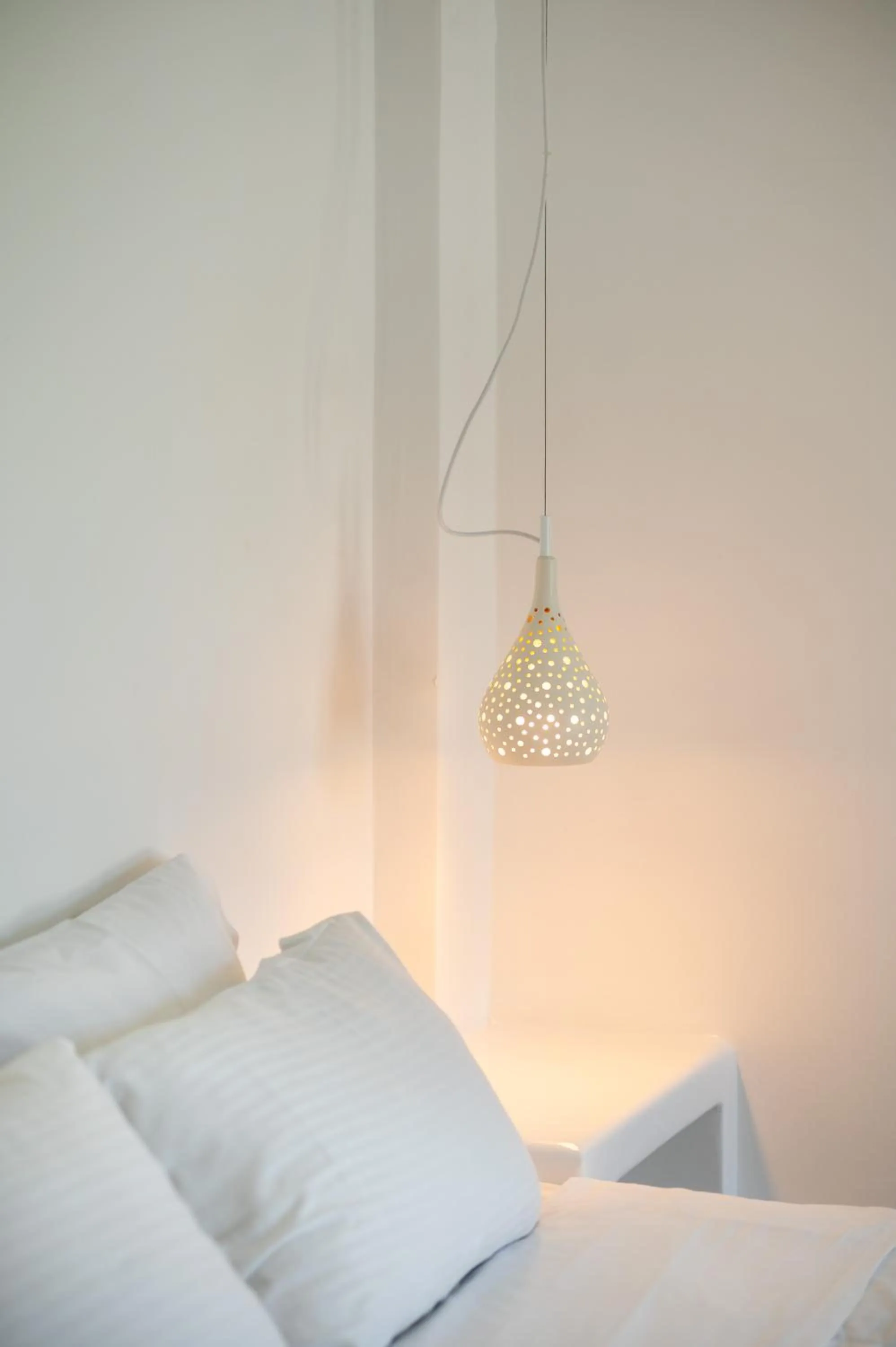 Bed in Amphitrite Suites Santorini