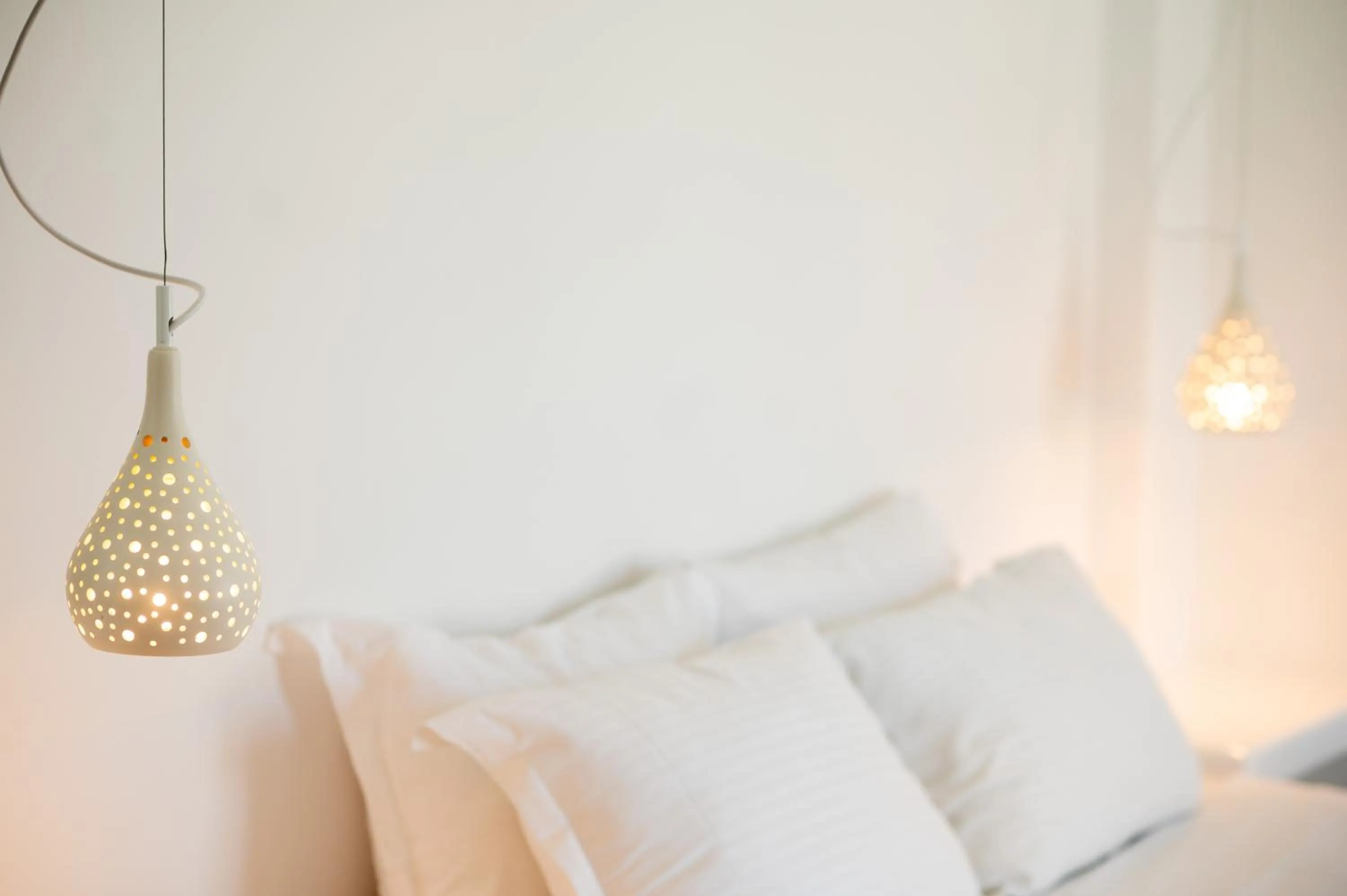 Bed in Amphitrite Suites Santorini