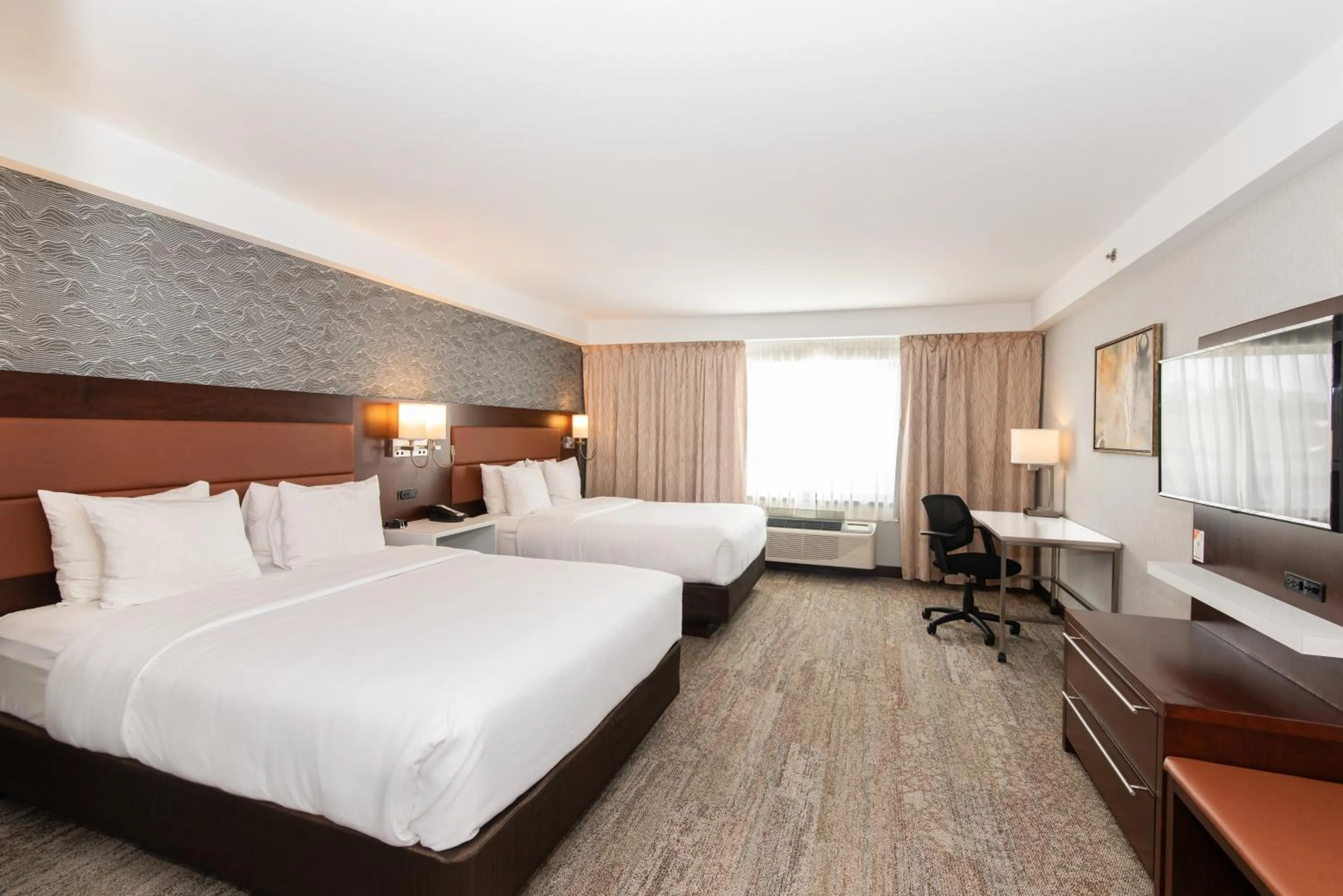 Bed in Quality Inn & Suites