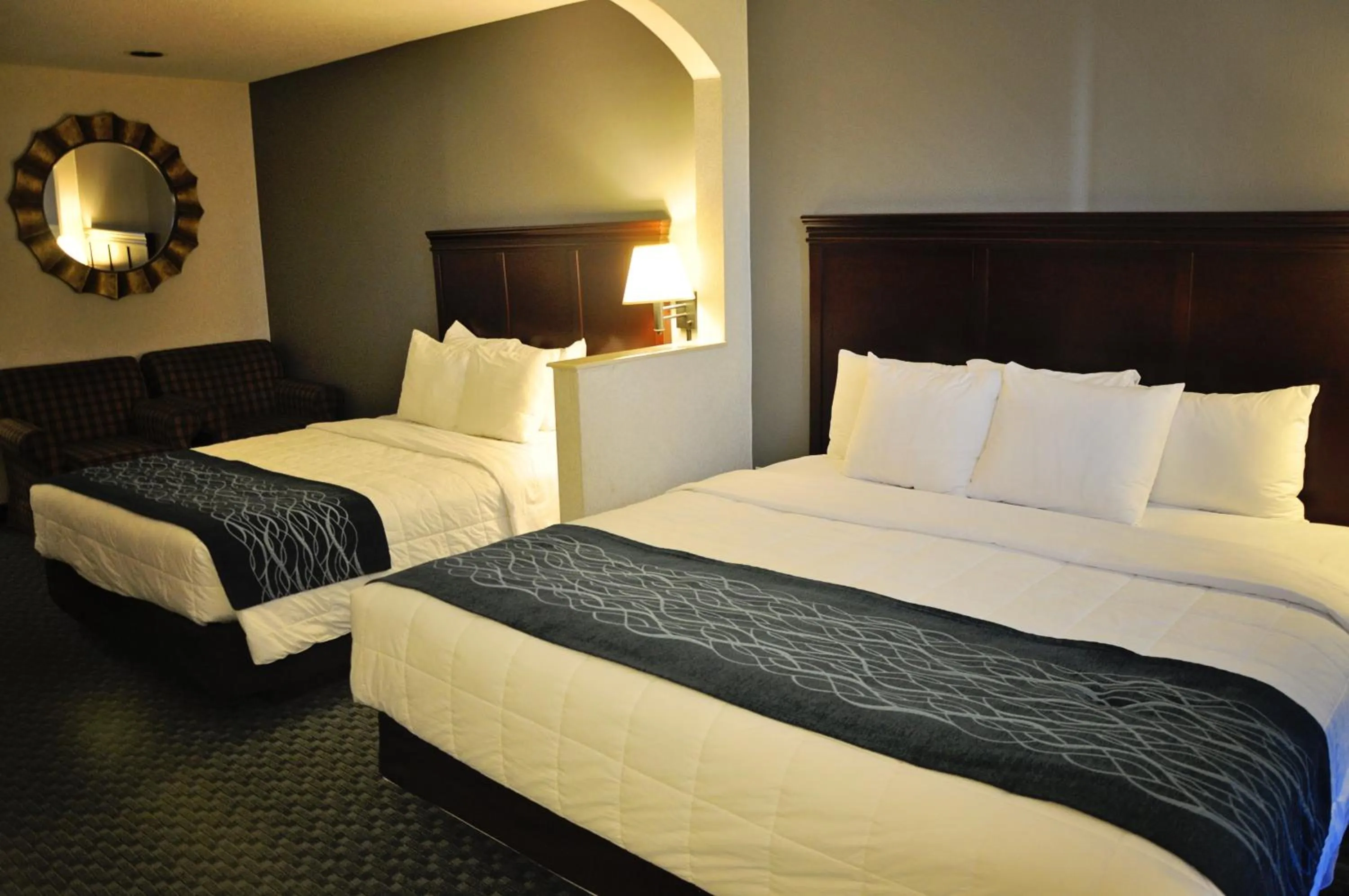 Bed in Dunes Express Inn and Suites