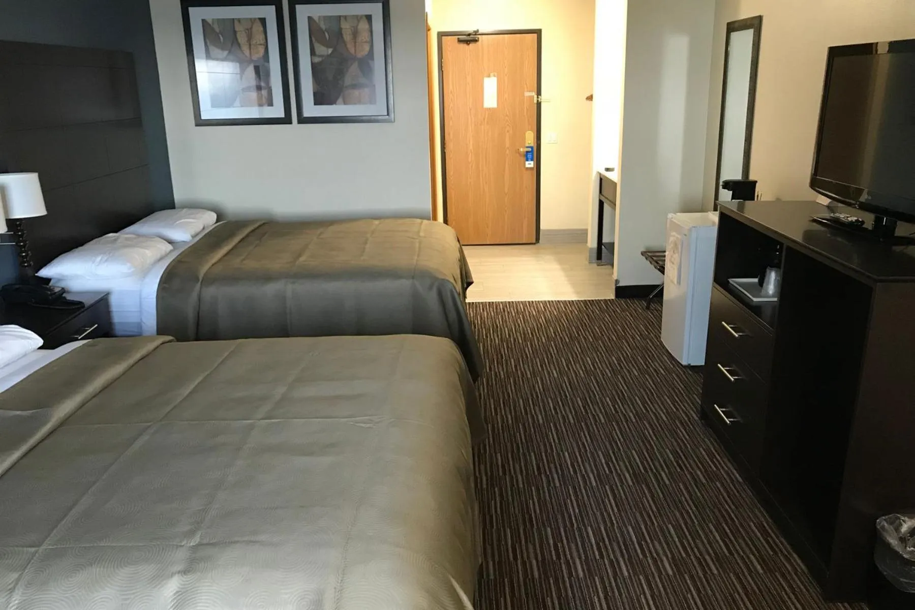 Bed in AmericInn by Wyndham Jefferson