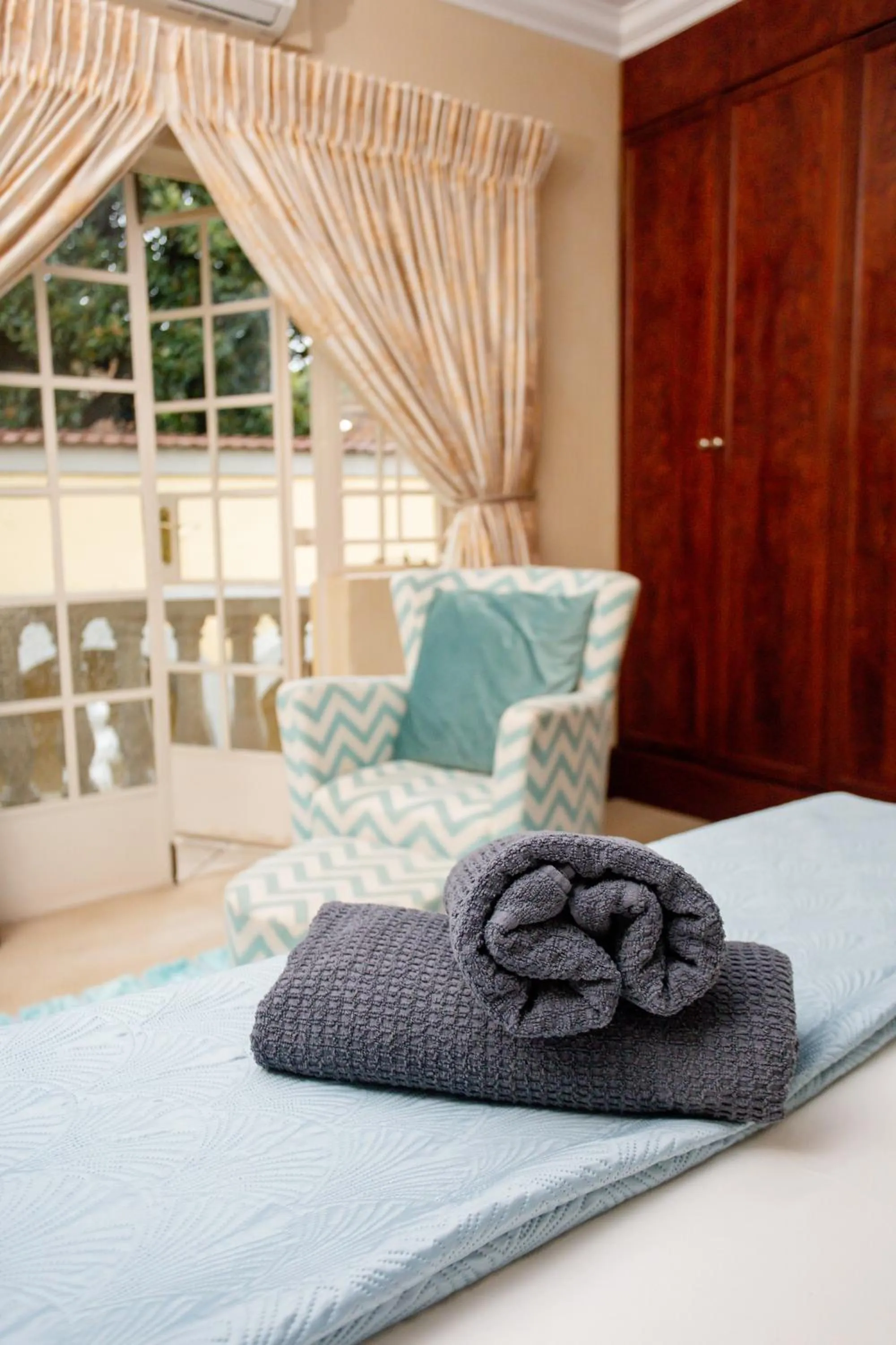 Seating area, Bed in TDM's Boutique Guest House