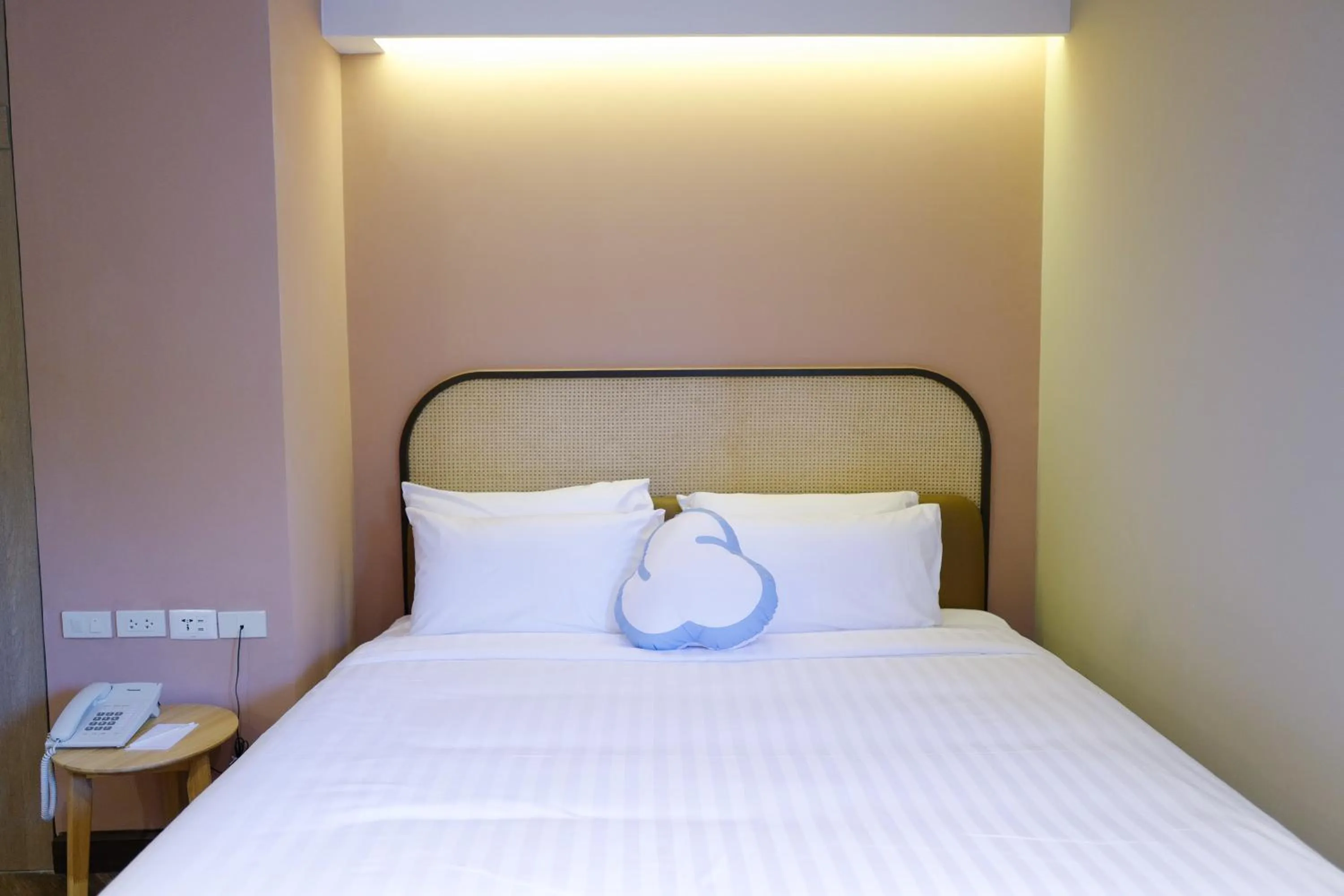 Bed in The Cotton Saladaeng Hotel