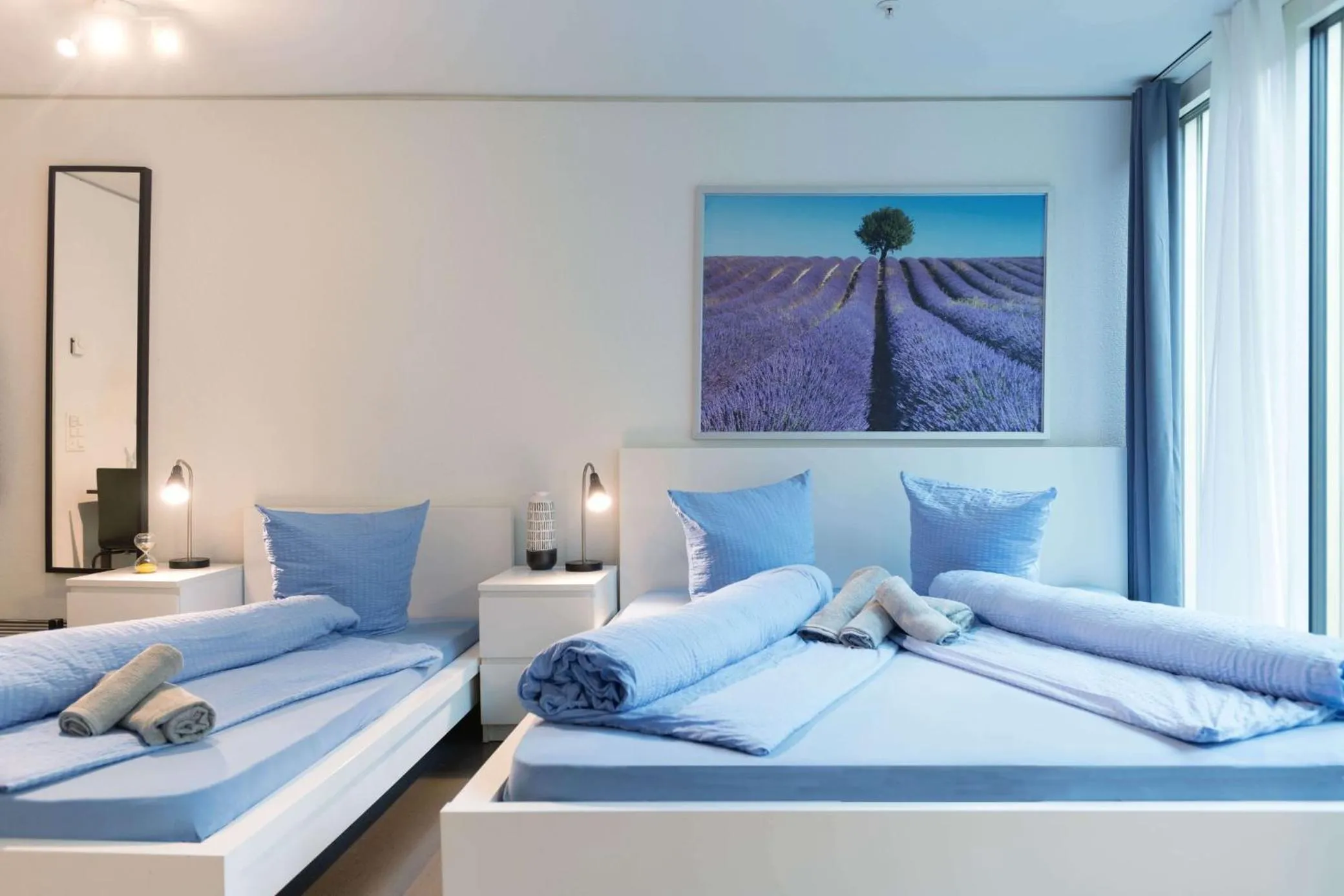 Bed in HITrental Allmend Comfort Studios