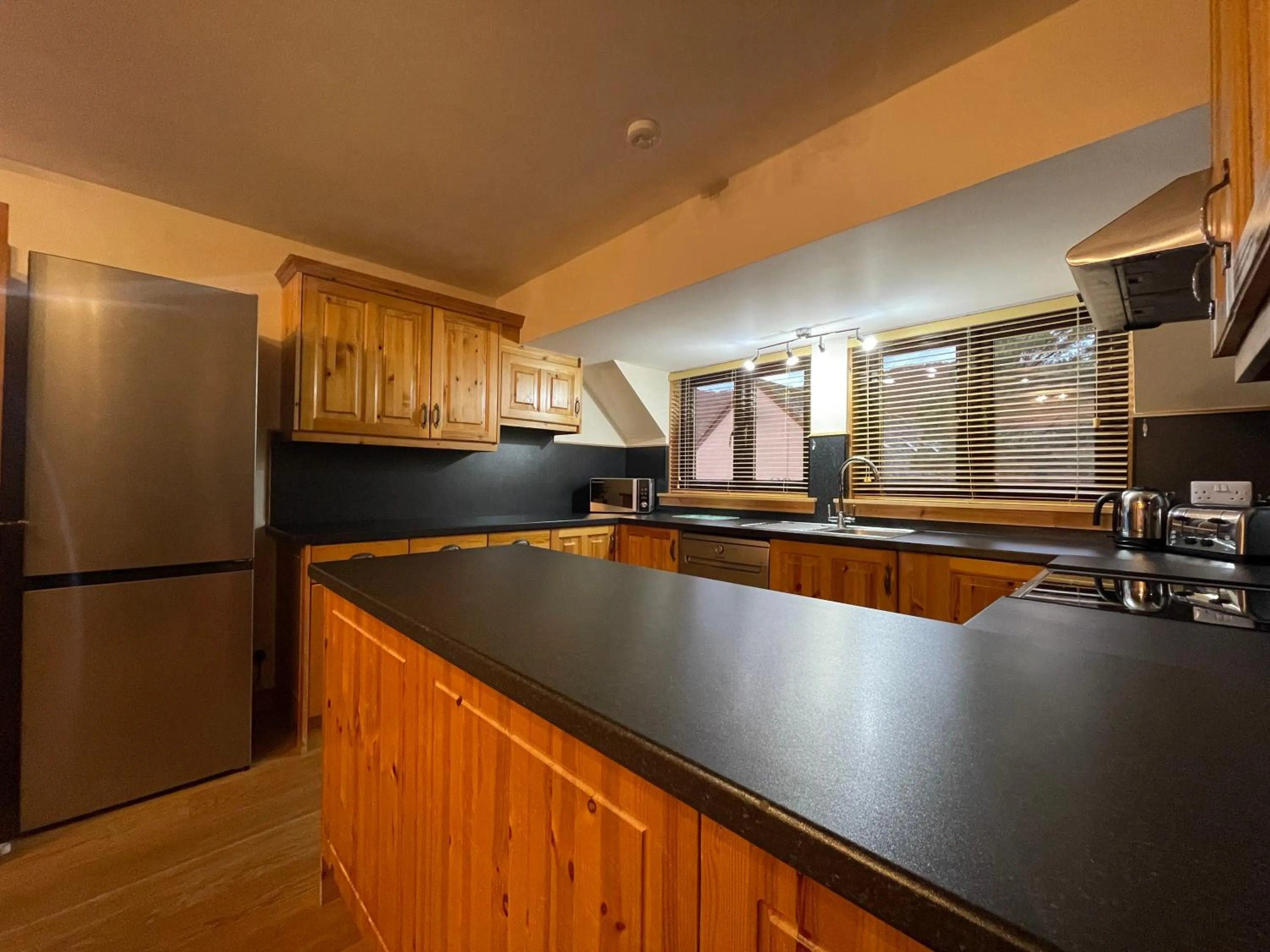 Kitchen or kitchenette in Scandinavian Village Ltd