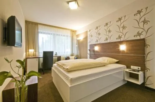 Photo of the whole room, Bed in Hotel Am Rosenberg