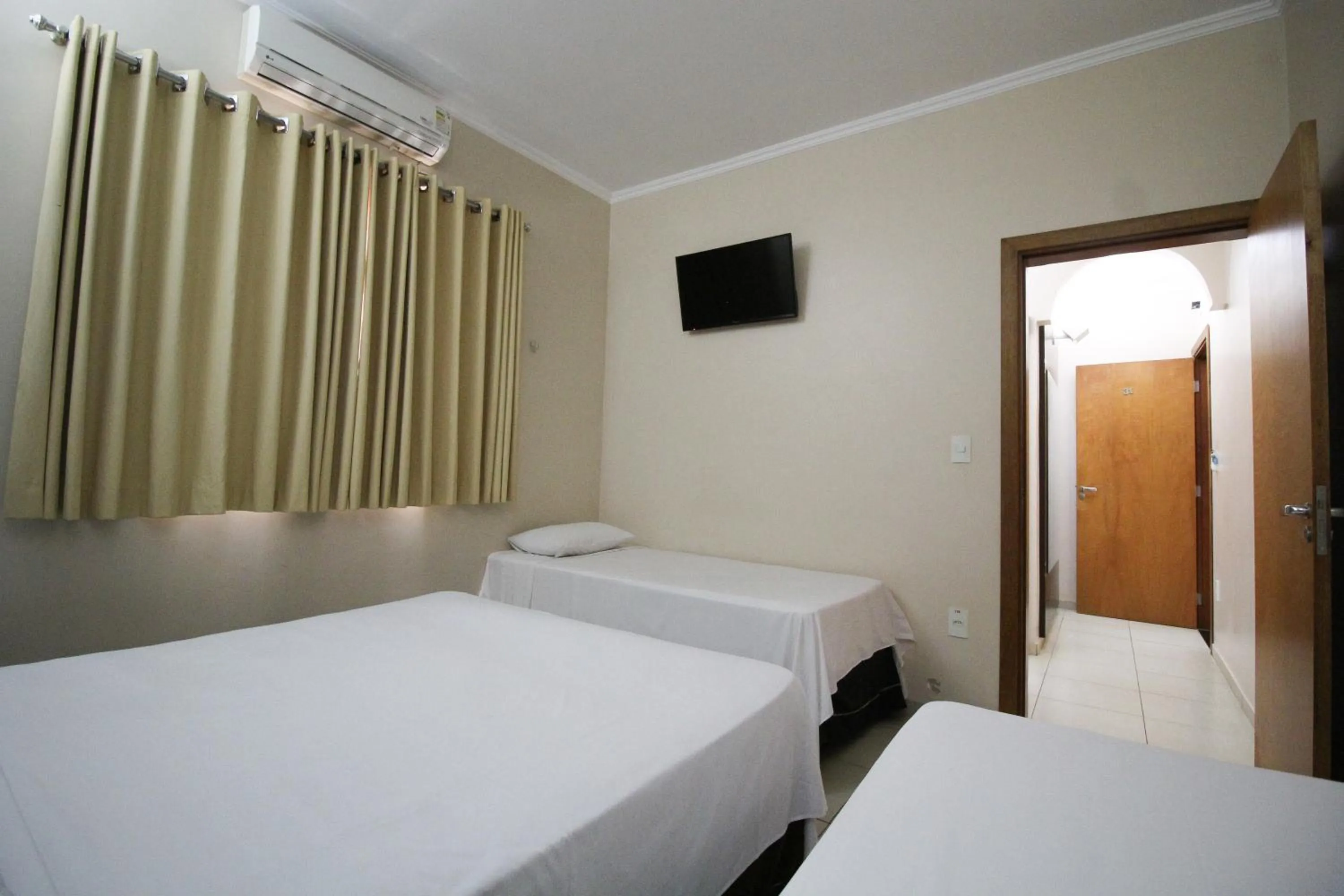 Bed in Pousada Água Eterna