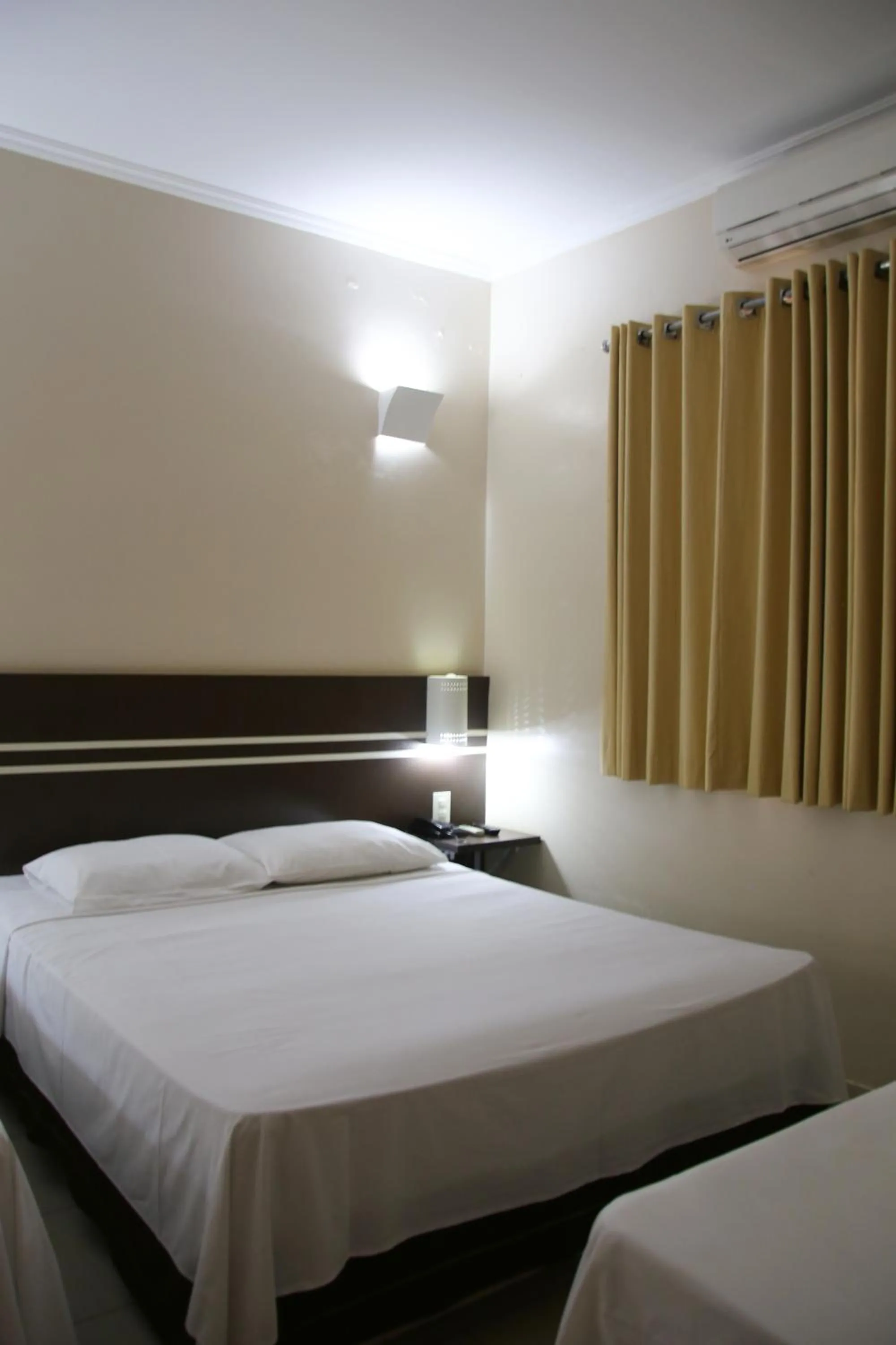 Bed in Pousada Água Eterna