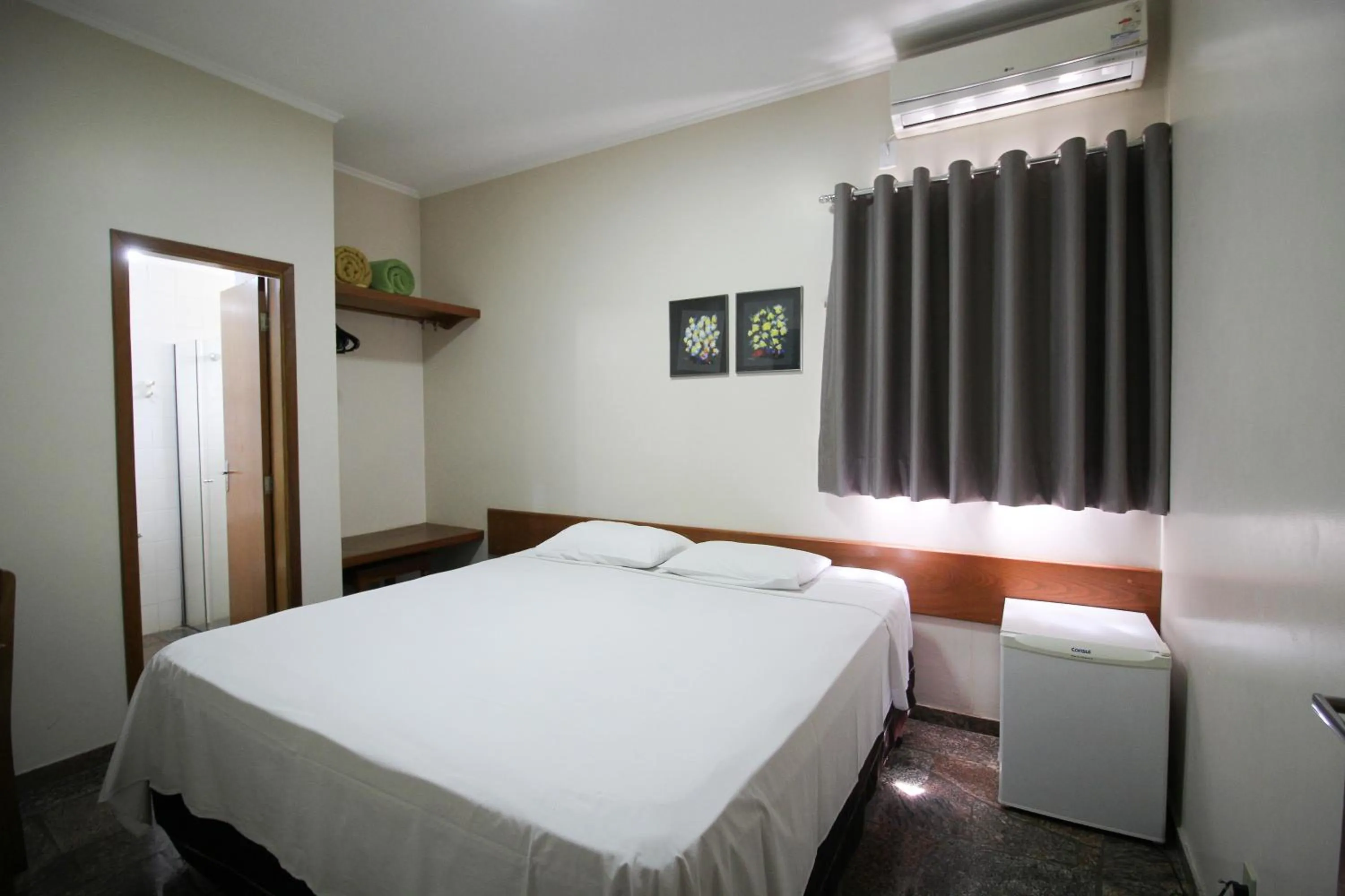 Bed in Pousada Água Eterna