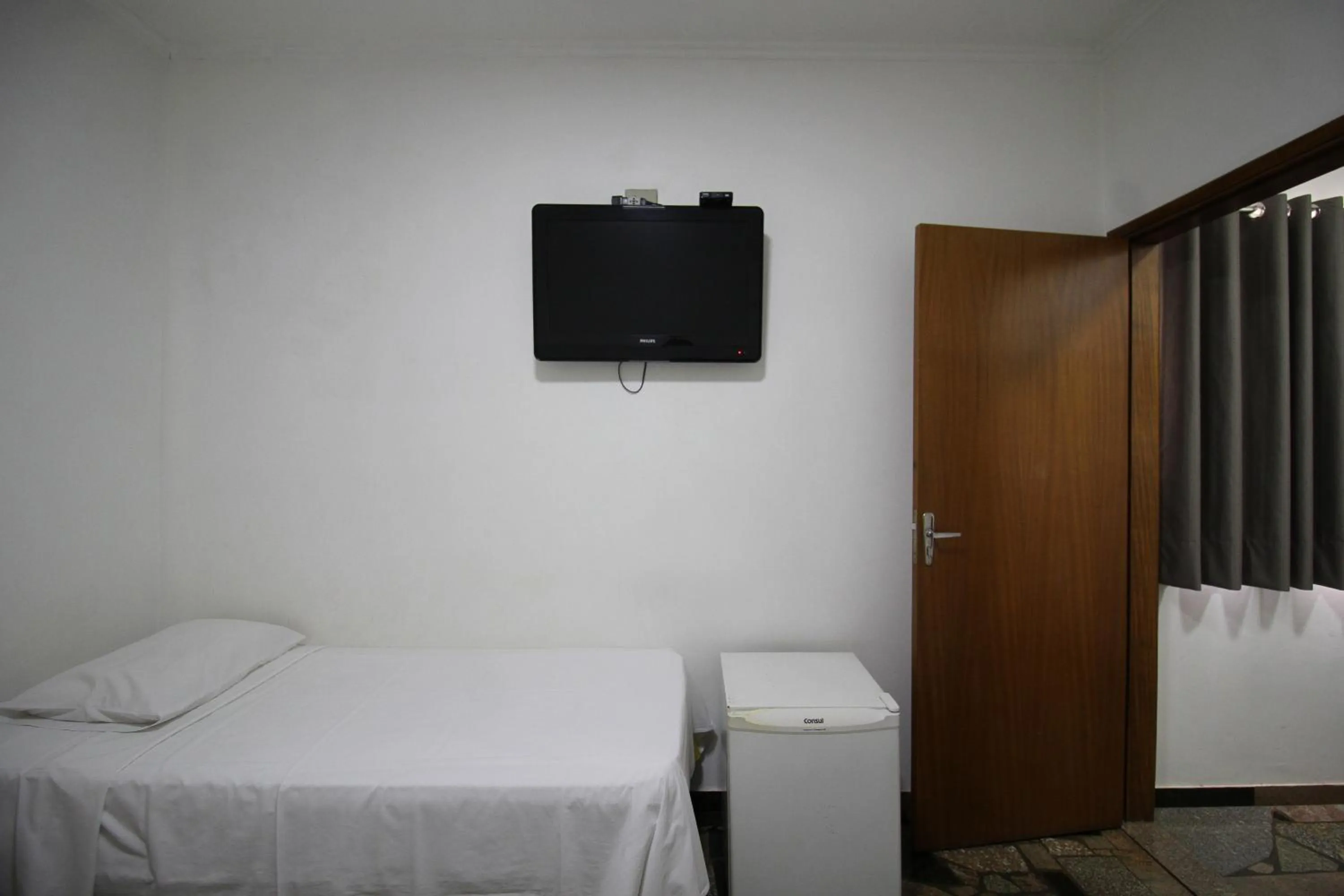 Bed in Pousada Água Eterna