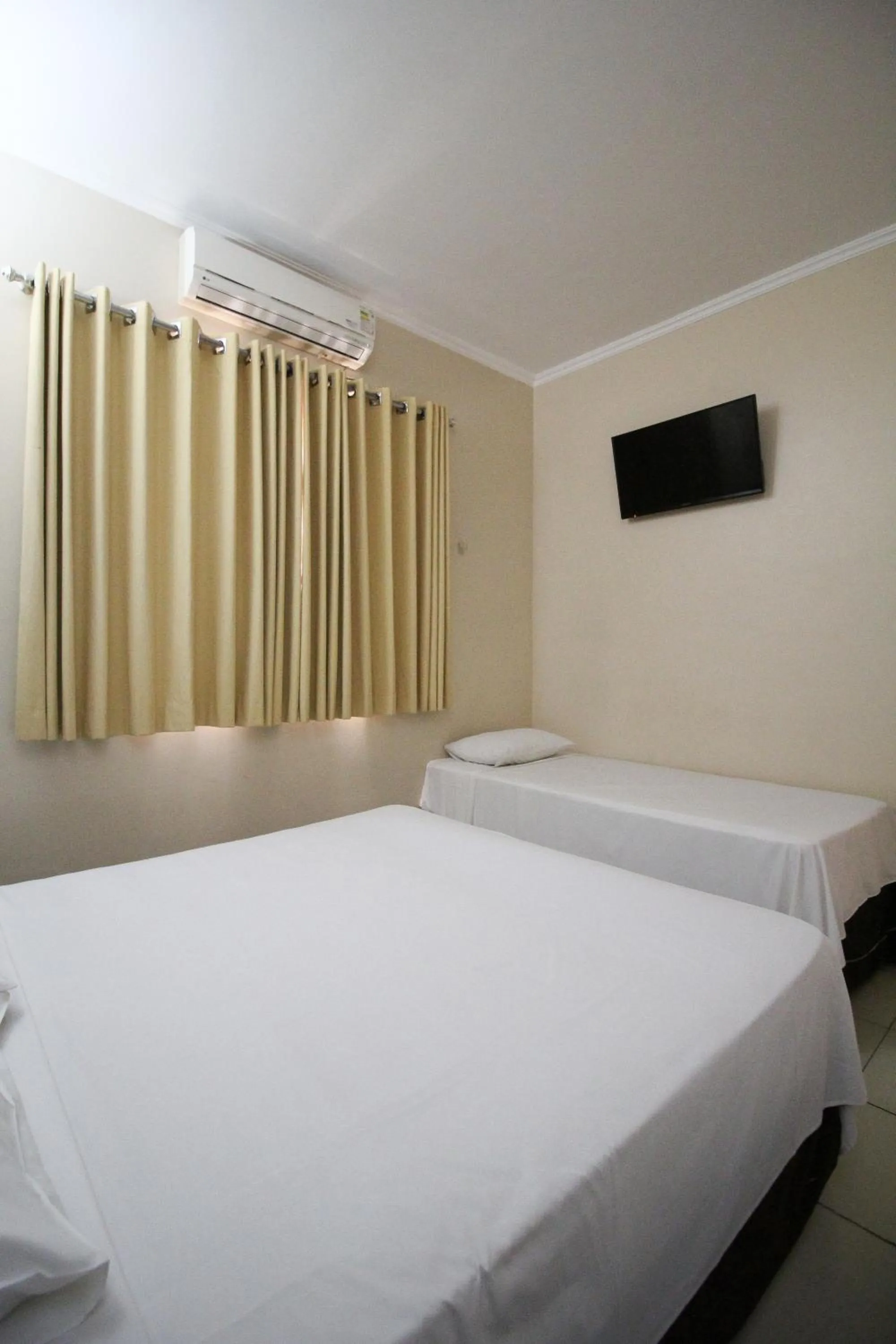 Bed in Pousada Água Eterna