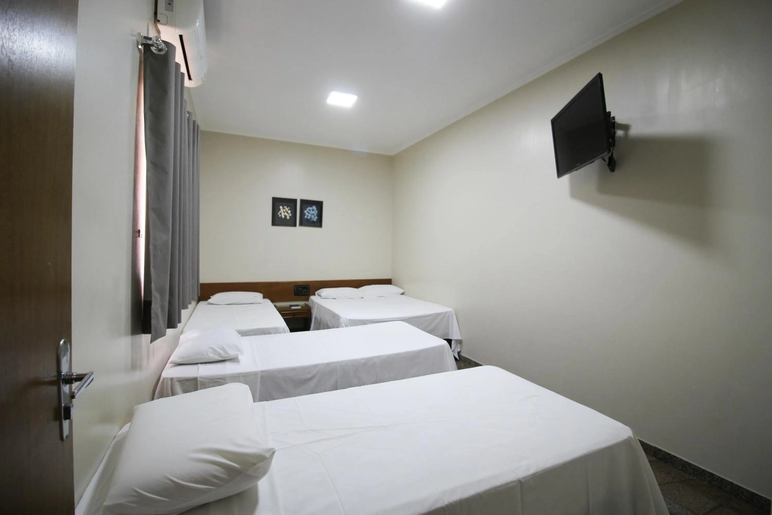 Bed in Pousada Água Eterna