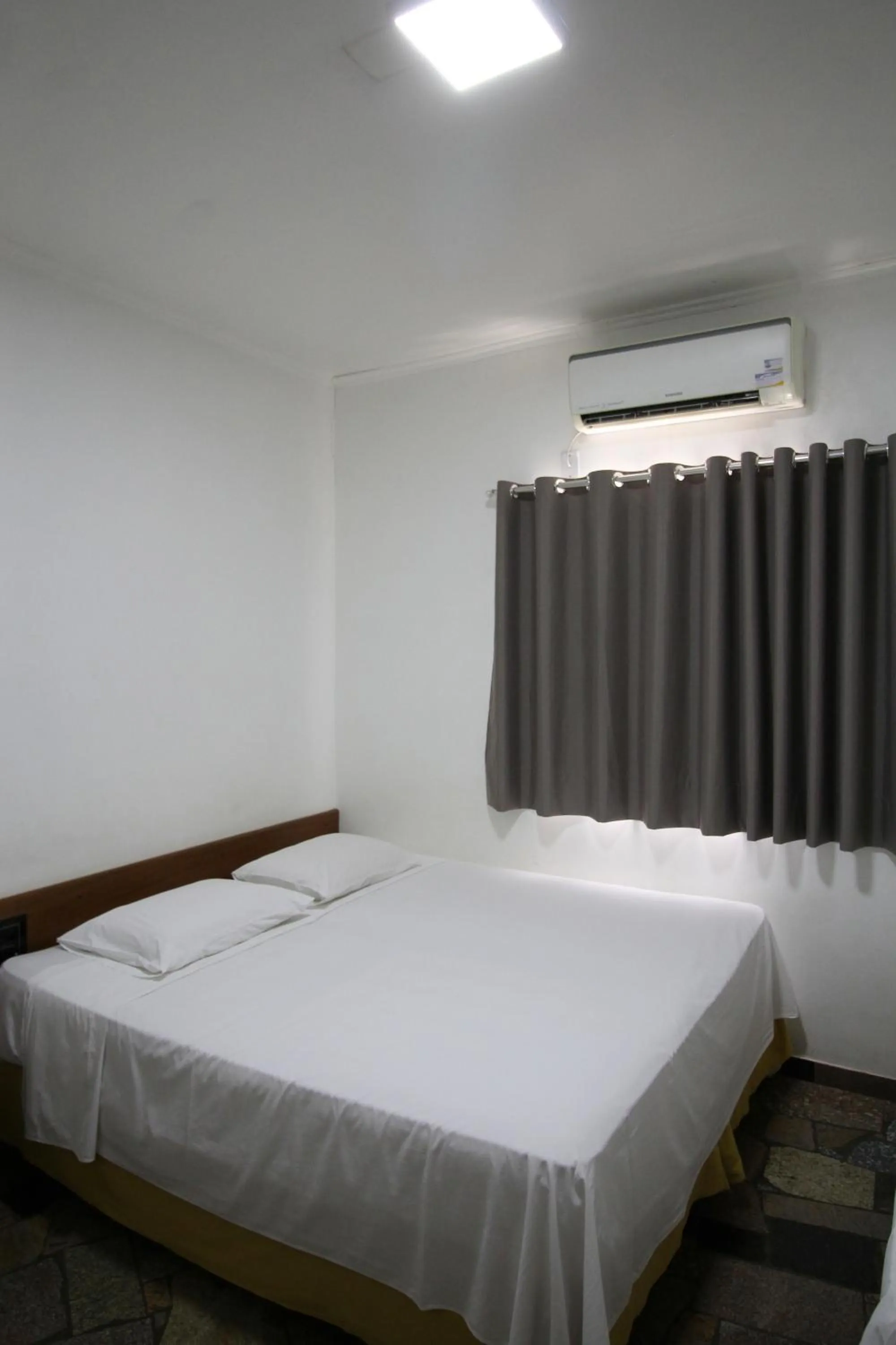 Bed in Pousada Água Eterna