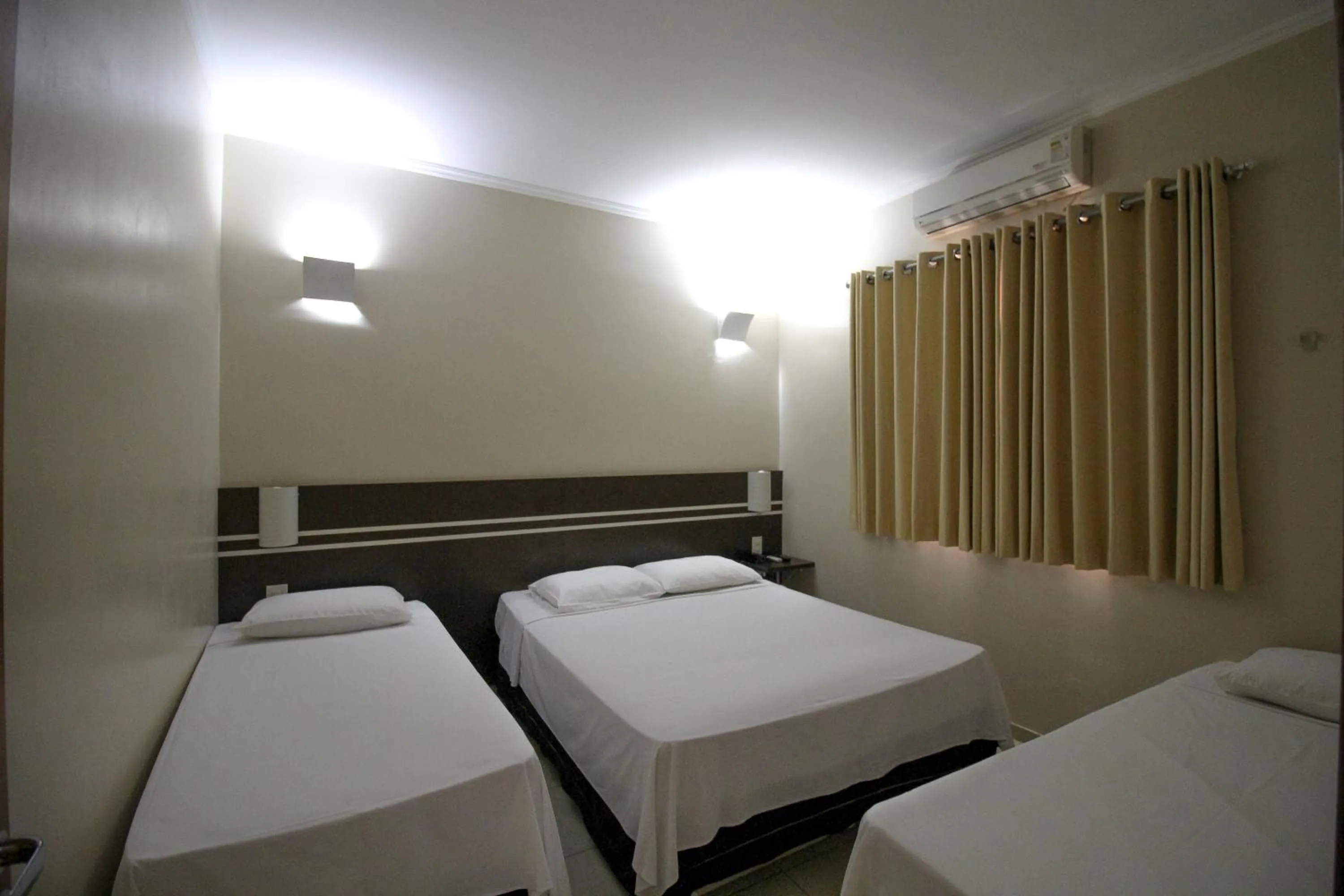 Bed in Pousada Água Eterna