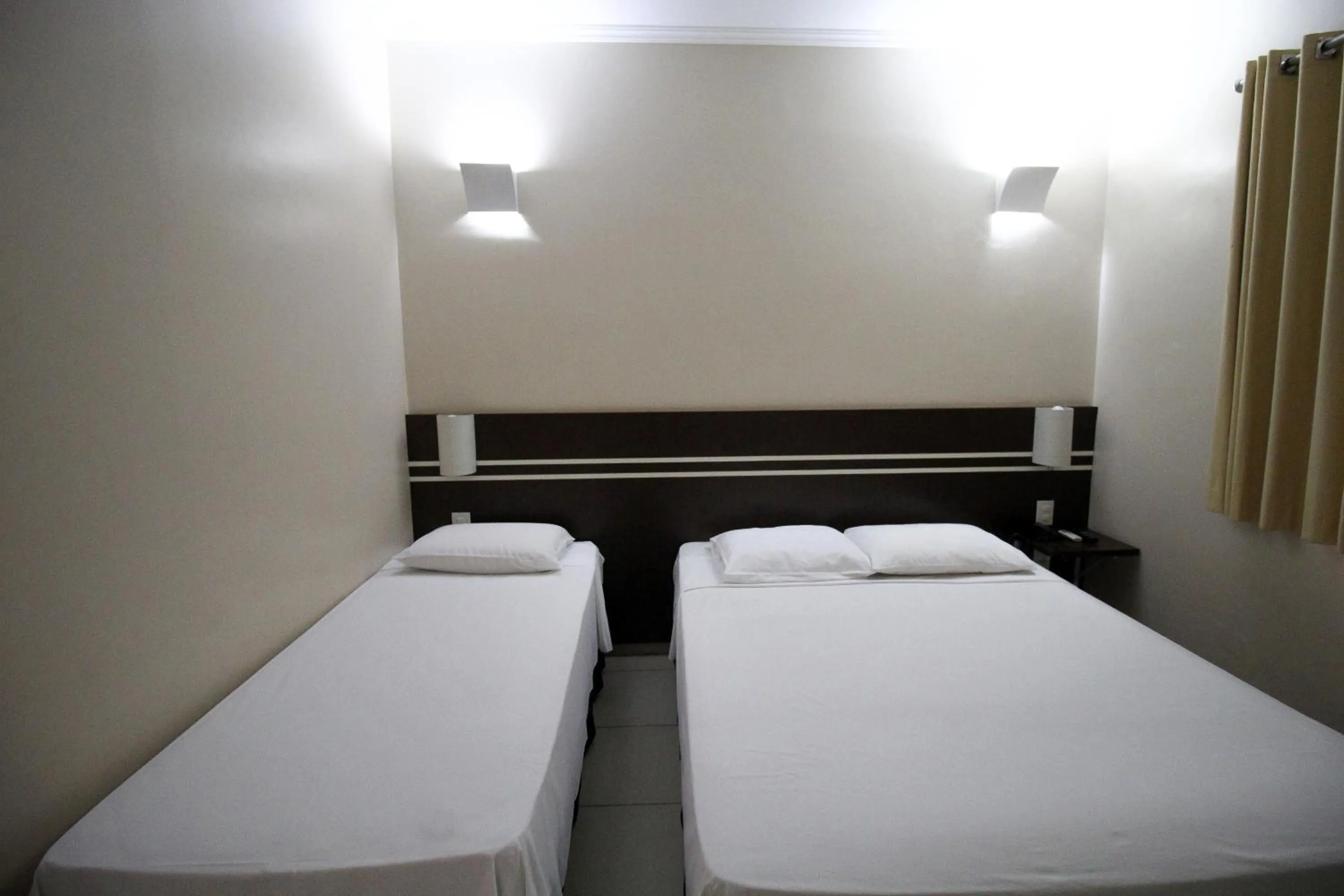 Bed in Pousada Água Eterna