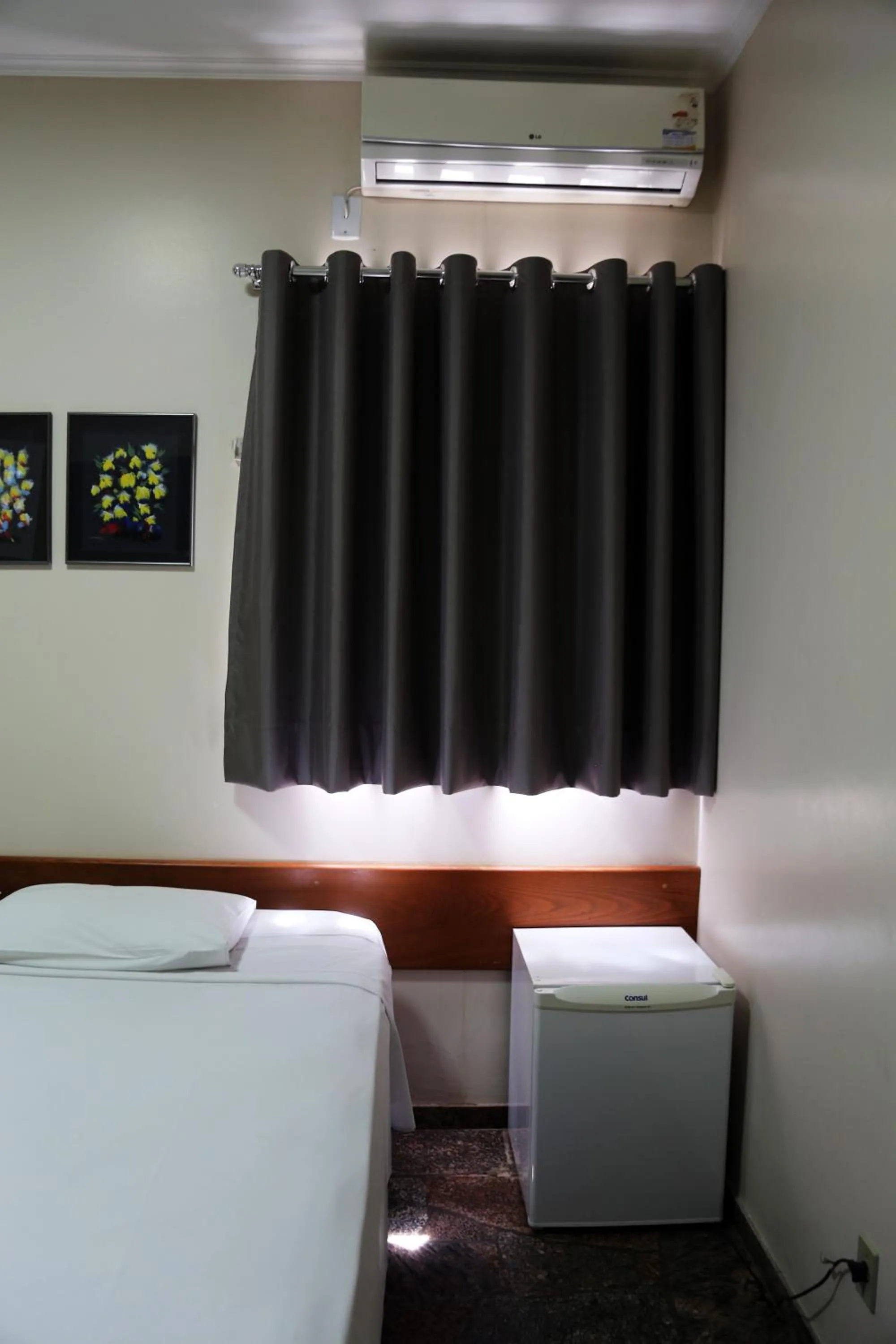 Bed in Pousada Água Eterna