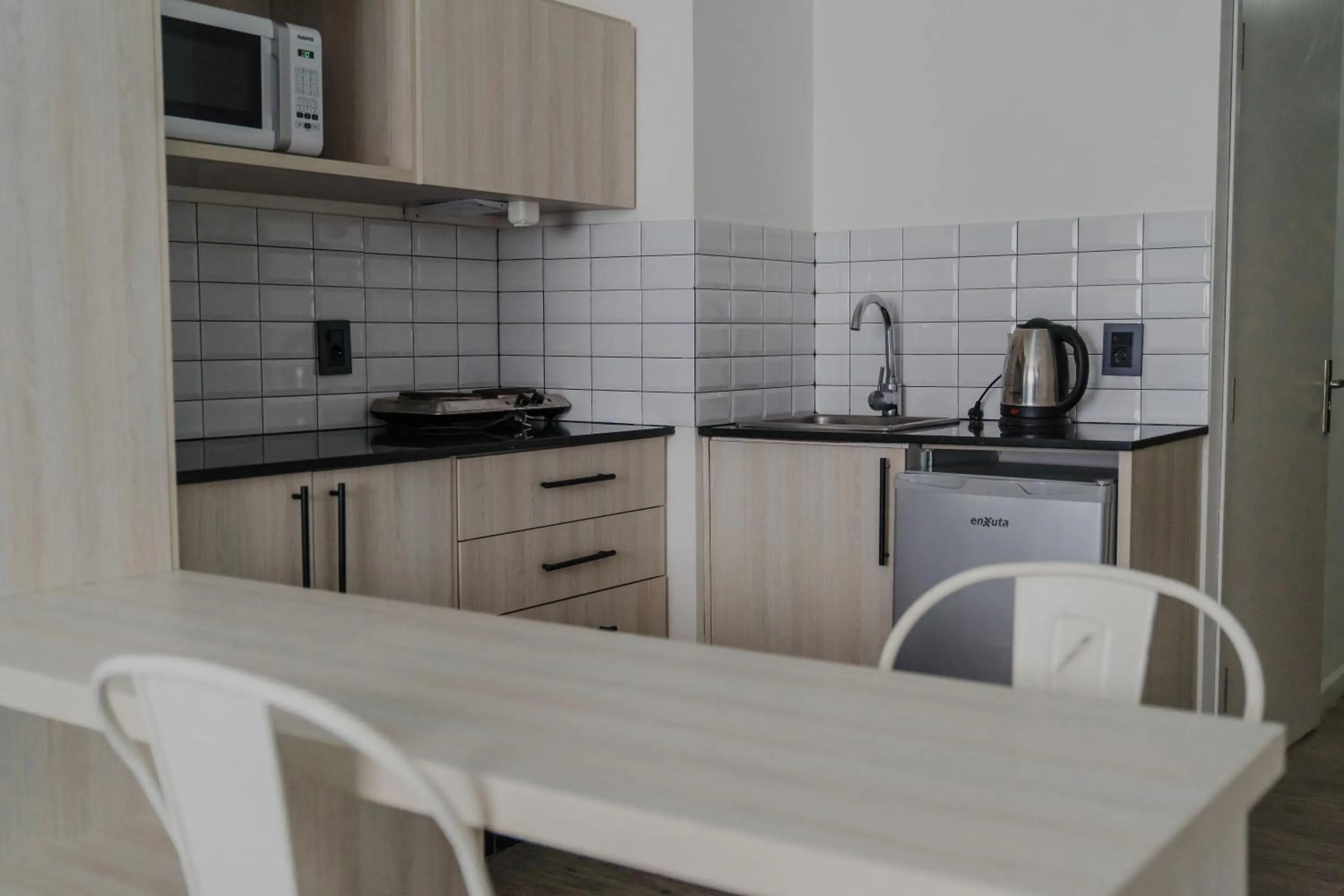 Kitchen or kitchenette in Quijano Hotel - Aparts & Suites