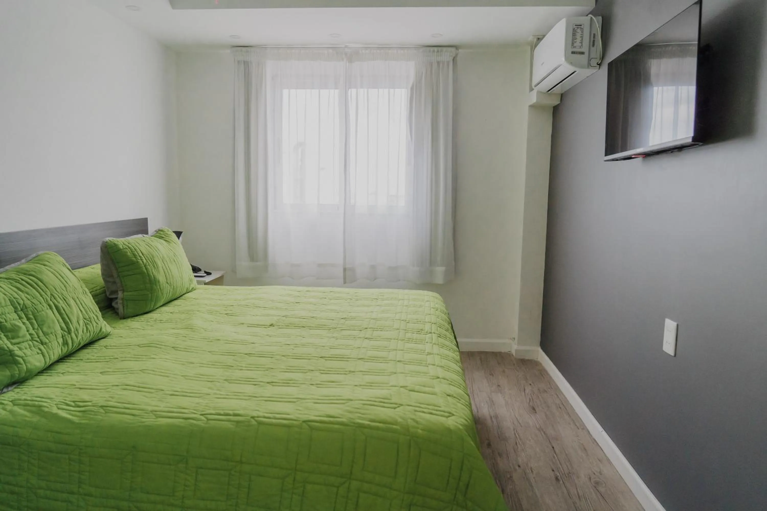 Bed in Quijano Hotel - Aparts & Suites