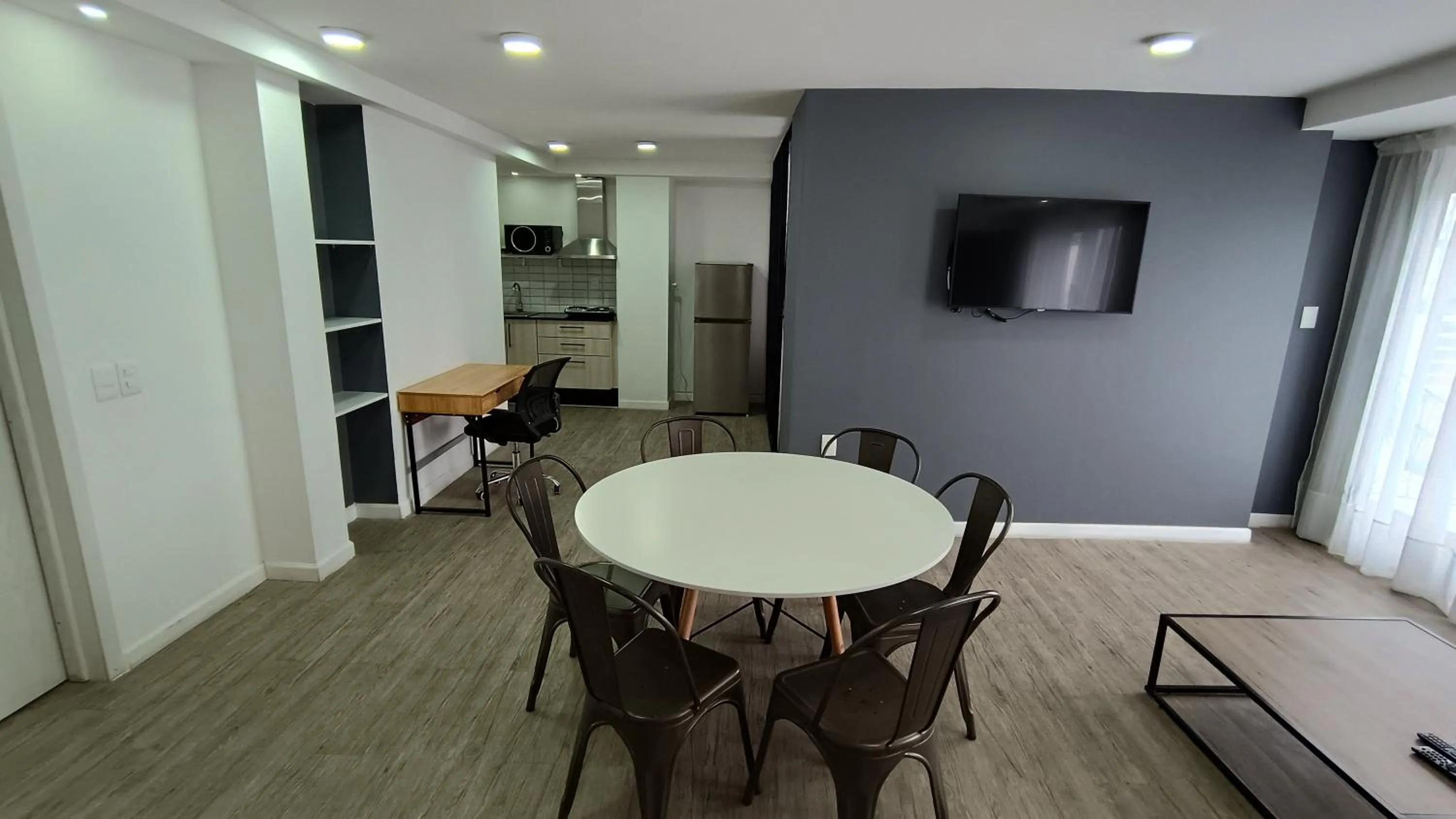 Communal lounge/ TV room in Quijano Hotel - Aparts & Suites