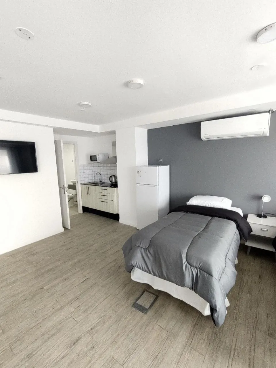 Bed in Quijano Hotel - Aparts & Suites