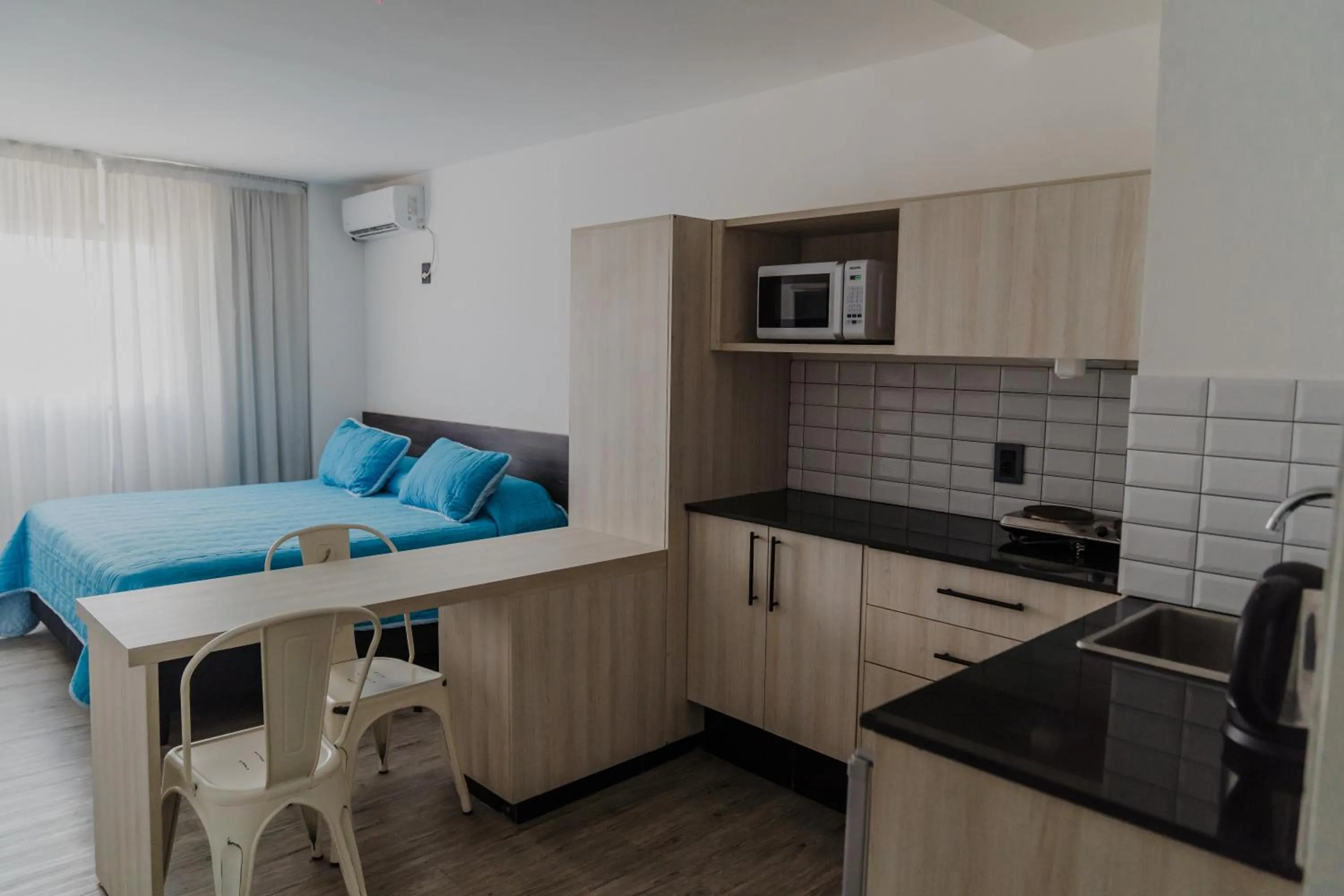 Bed in Quijano Hotel - Aparts & Suites