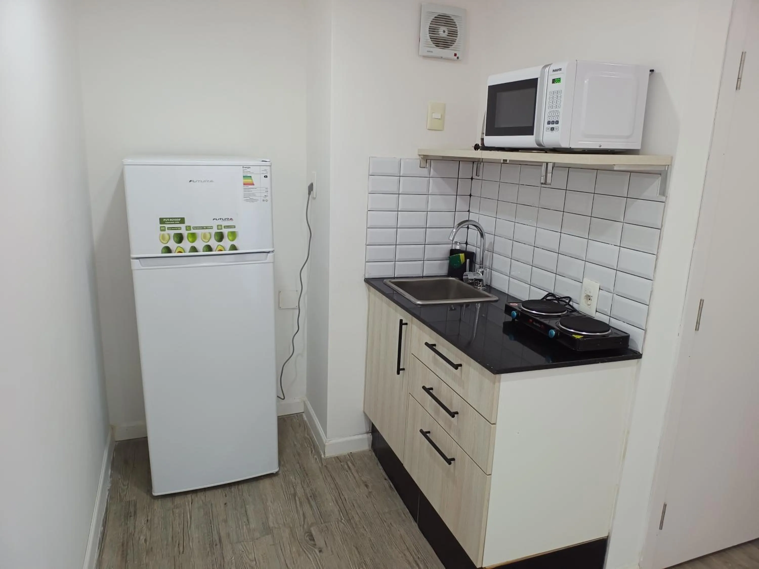 Kitchen or kitchenette in Quijano Hotel - Aparts & Suites