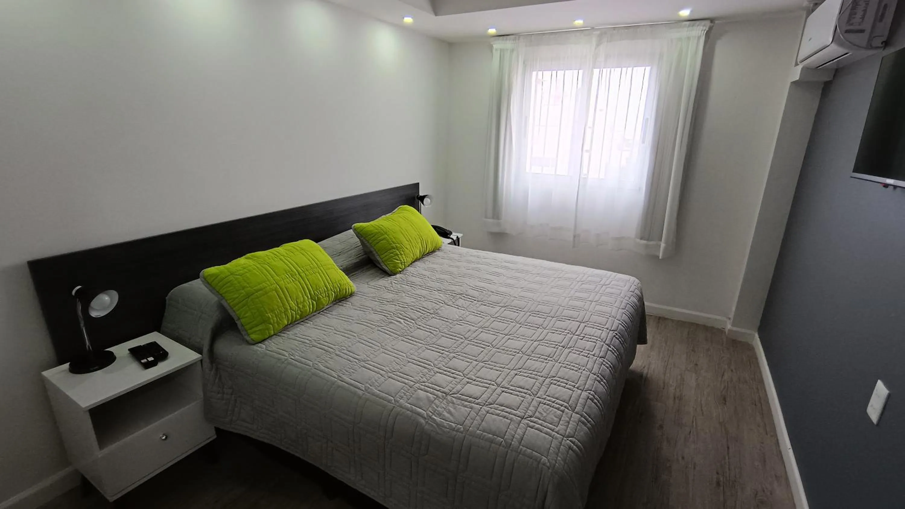 Bed in Quijano Hotel - Aparts & Suites