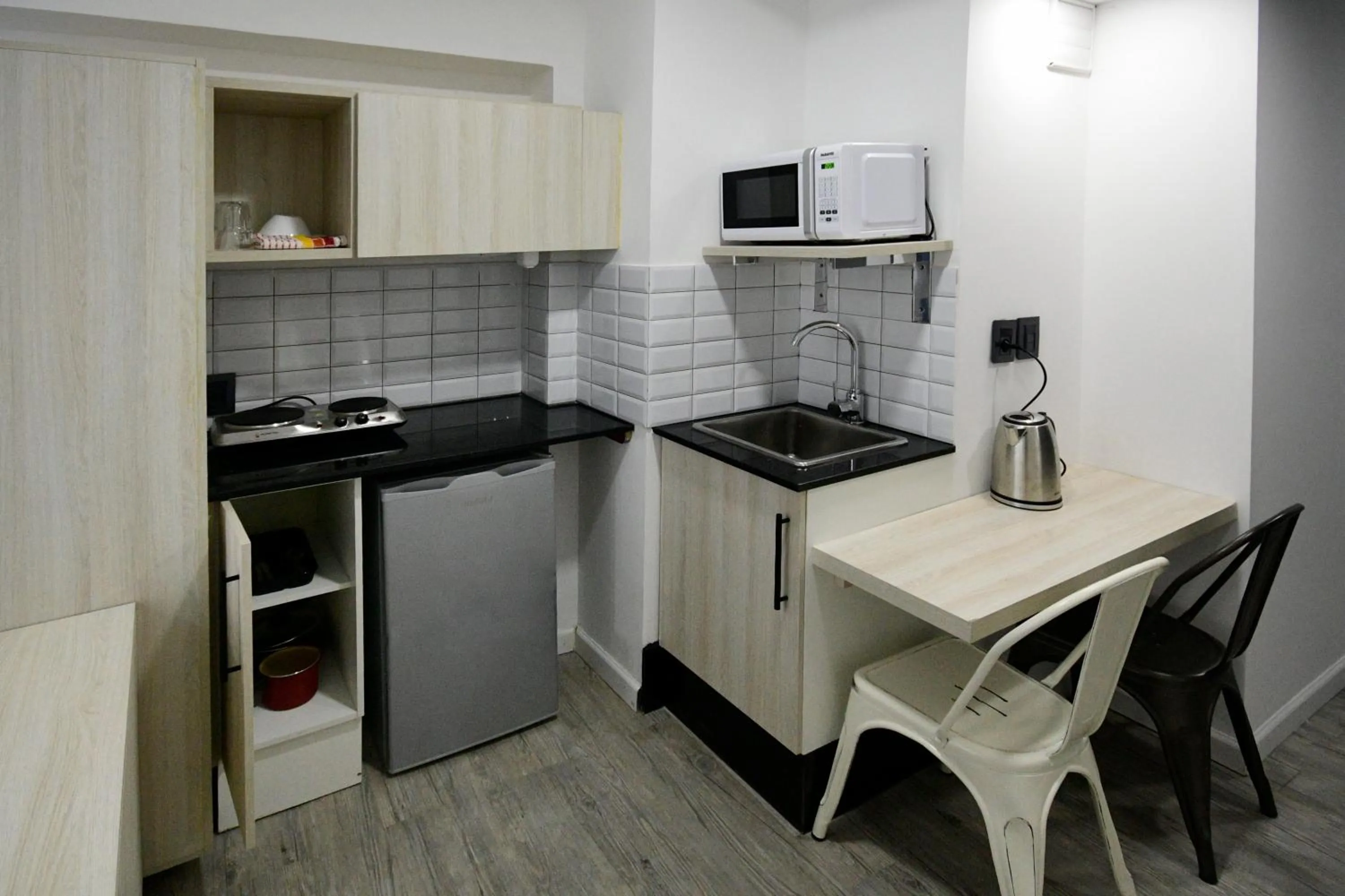 Kitchen or kitchenette in Quijano Hotel - Aparts & Suites