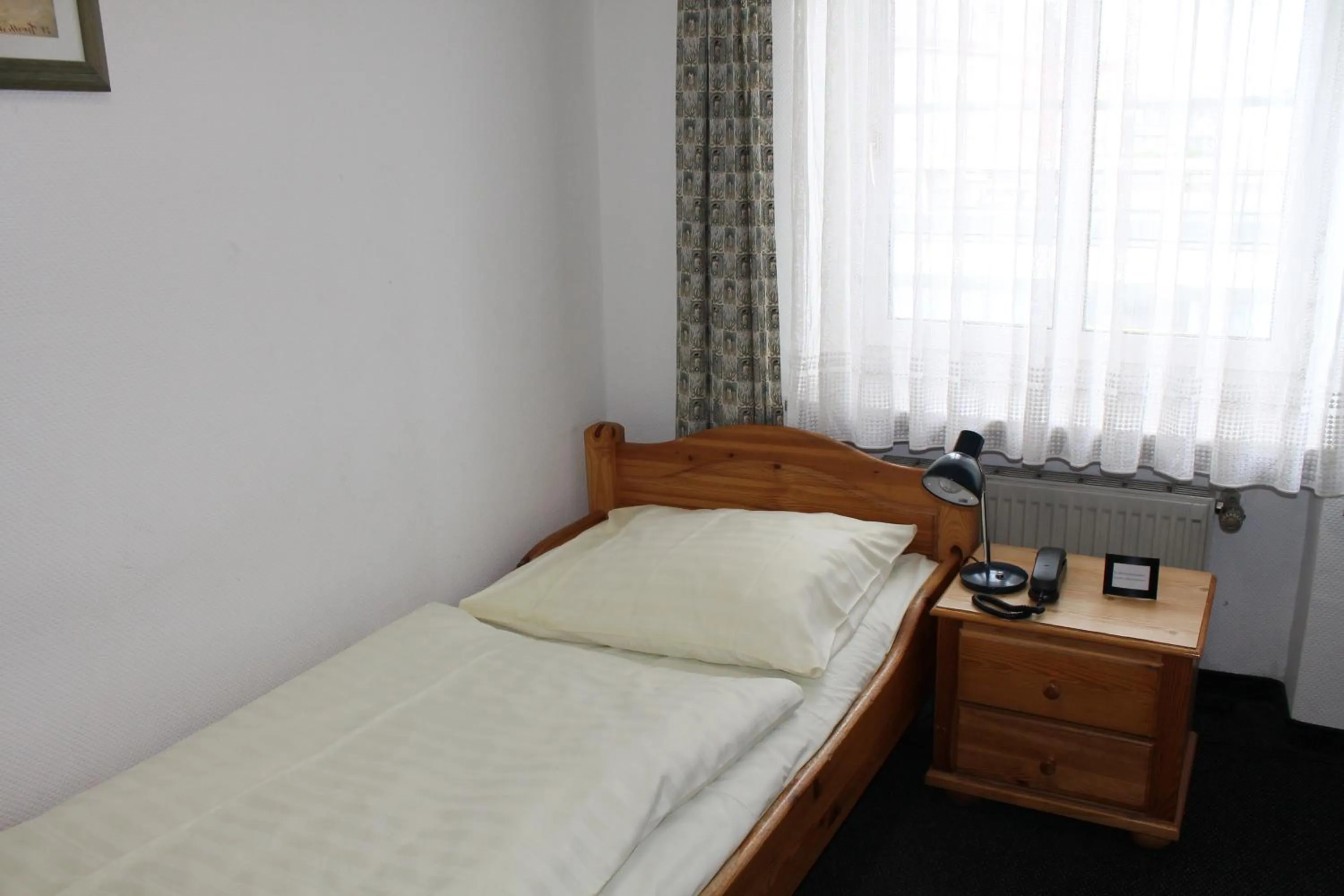 Bed in Pension Locarno