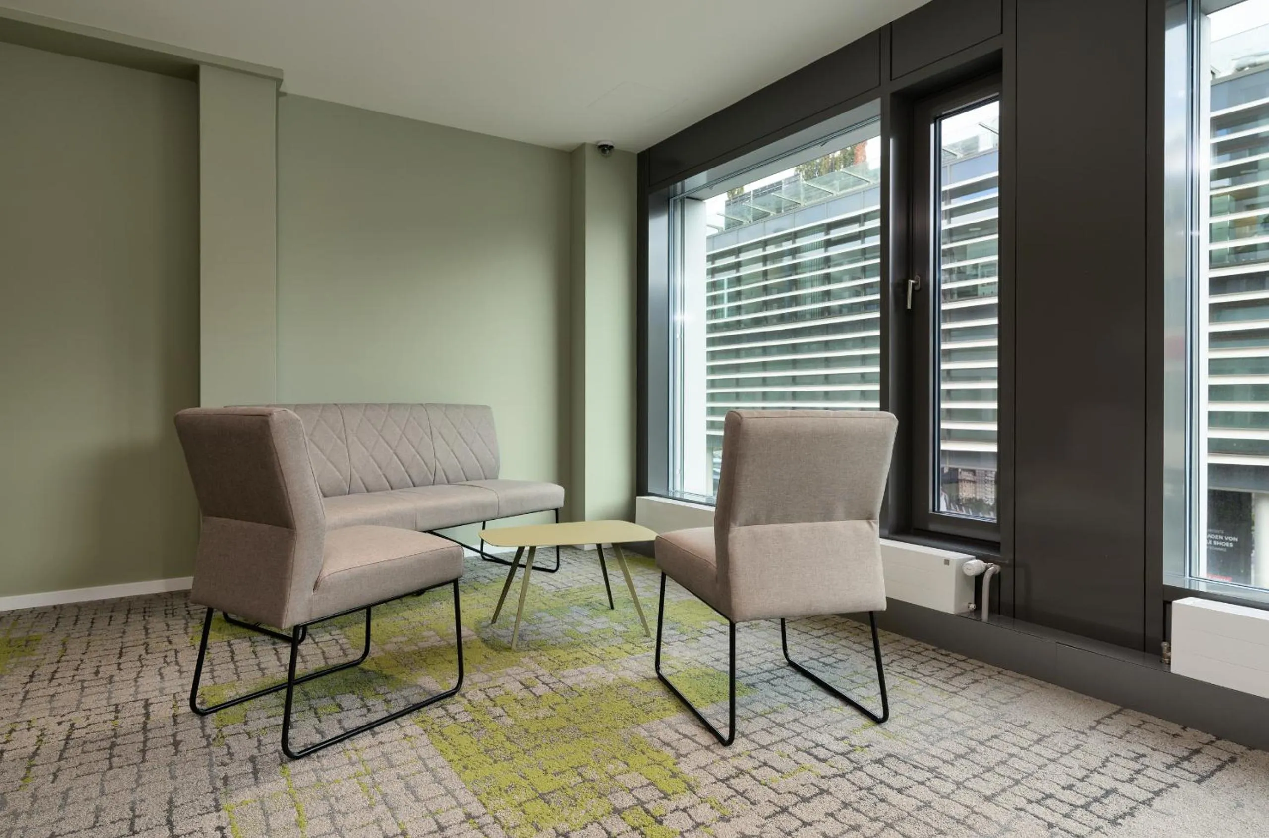 Communal lounge/ TV room in flexymotel Wil