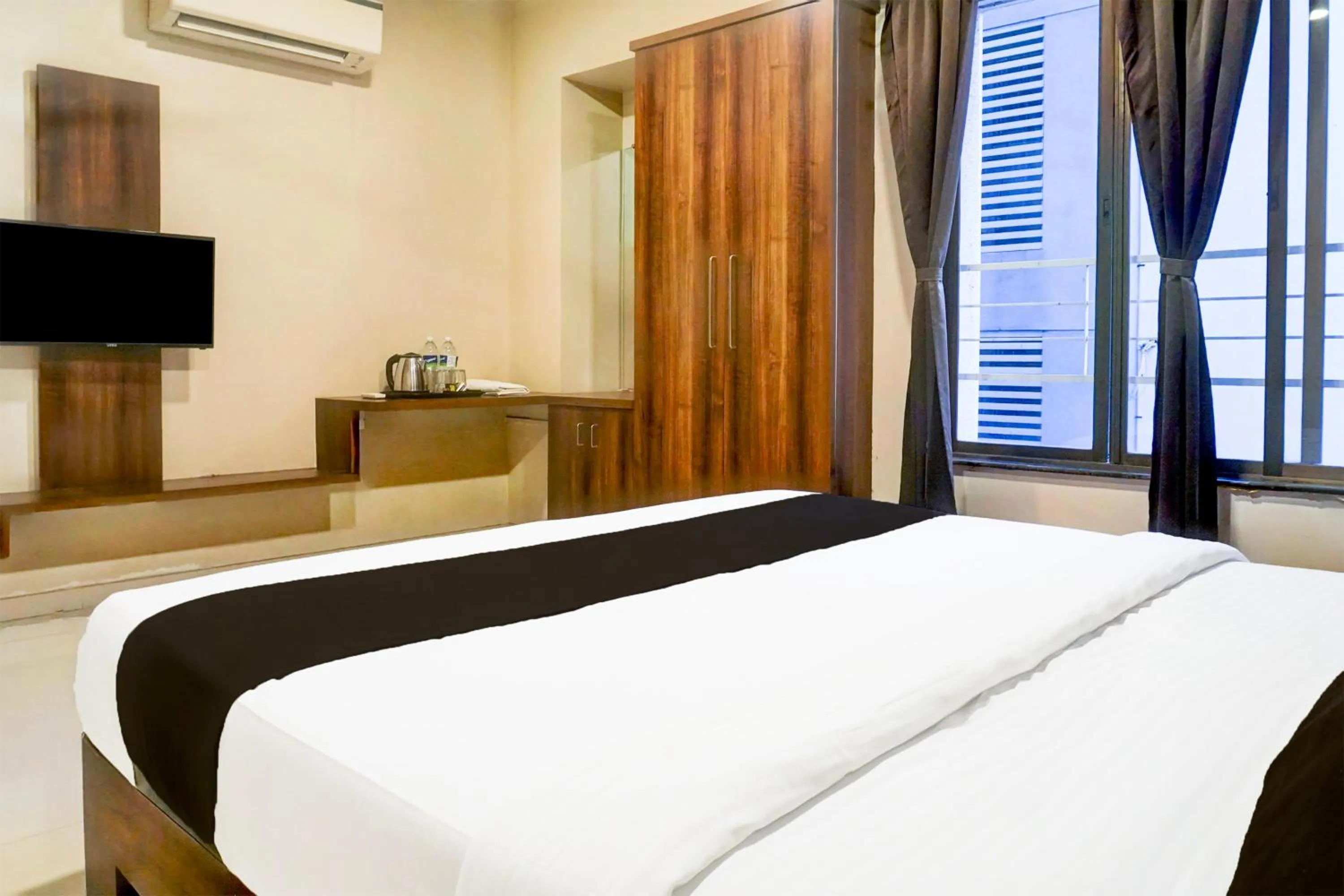 Bedroom, Bed in Super Townhouse Oak Viman Nagar Formerly Kuber Inn