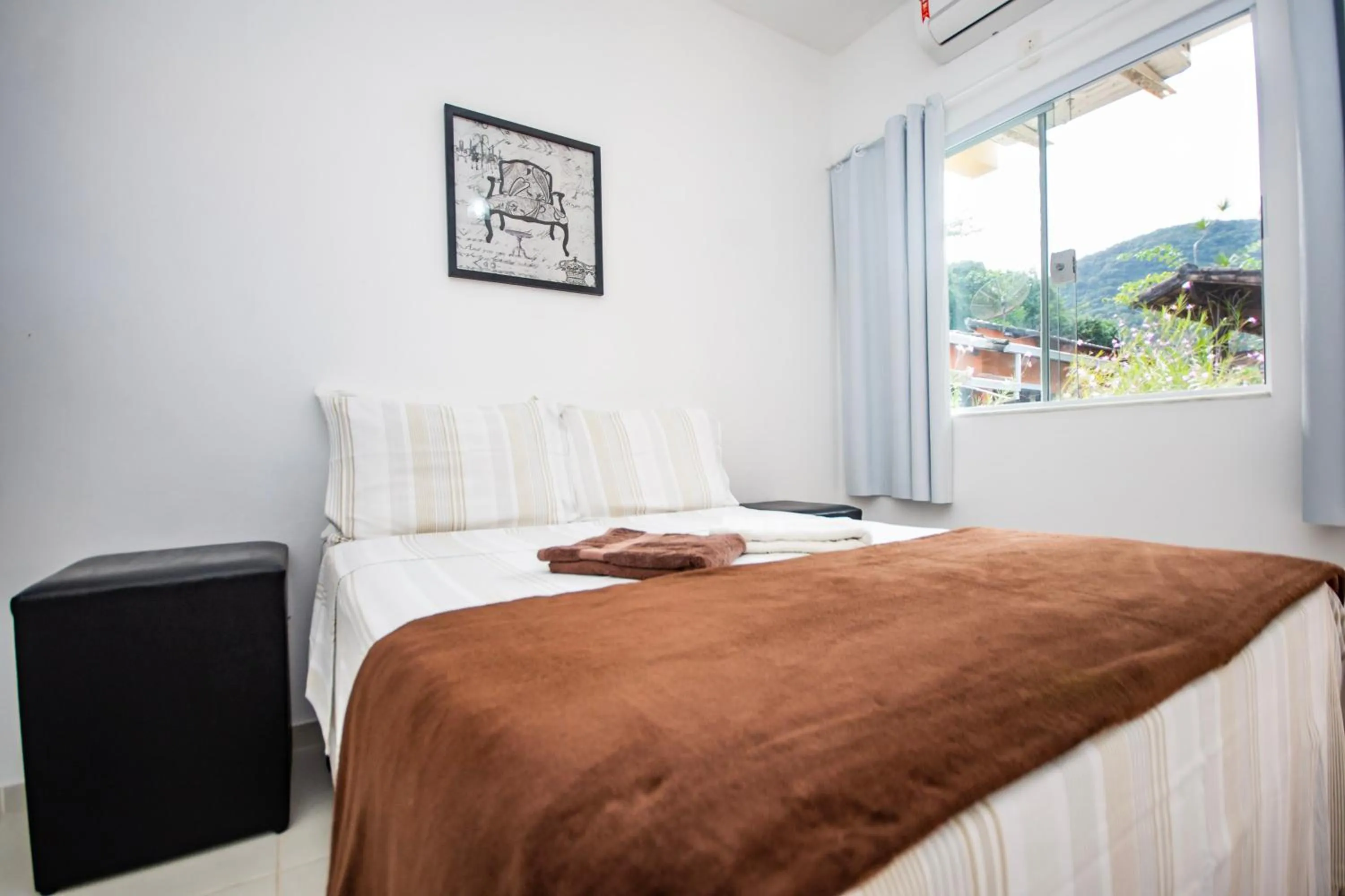 Bed in Pousada Quatro Estações Paraty