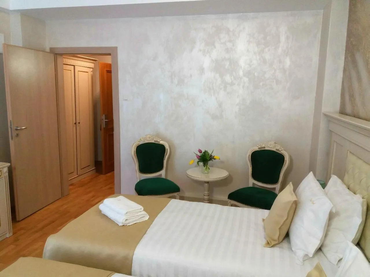 Bed in Park Luxury Rooms