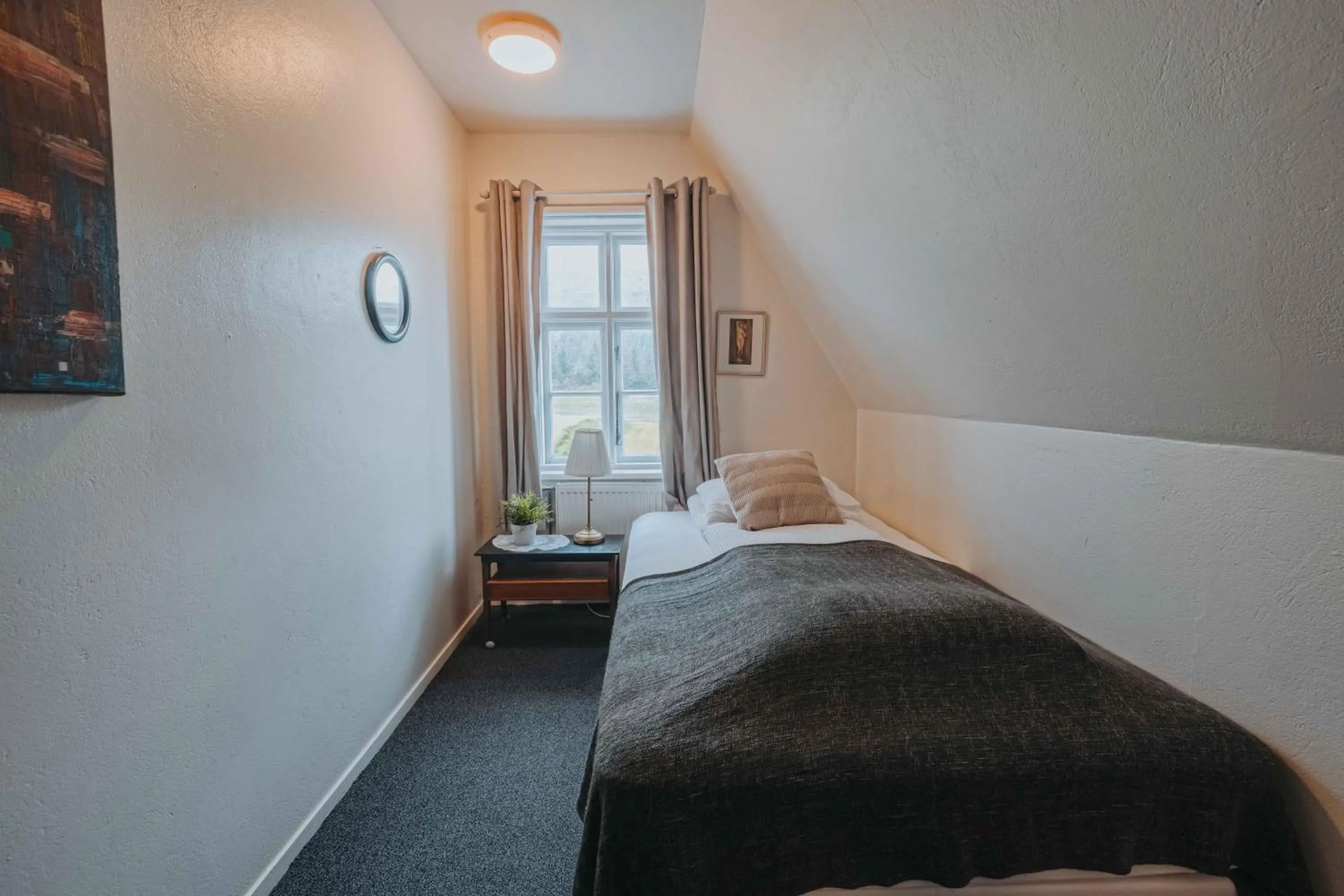 Bed in Héradsskólinn Historic Guesthouse