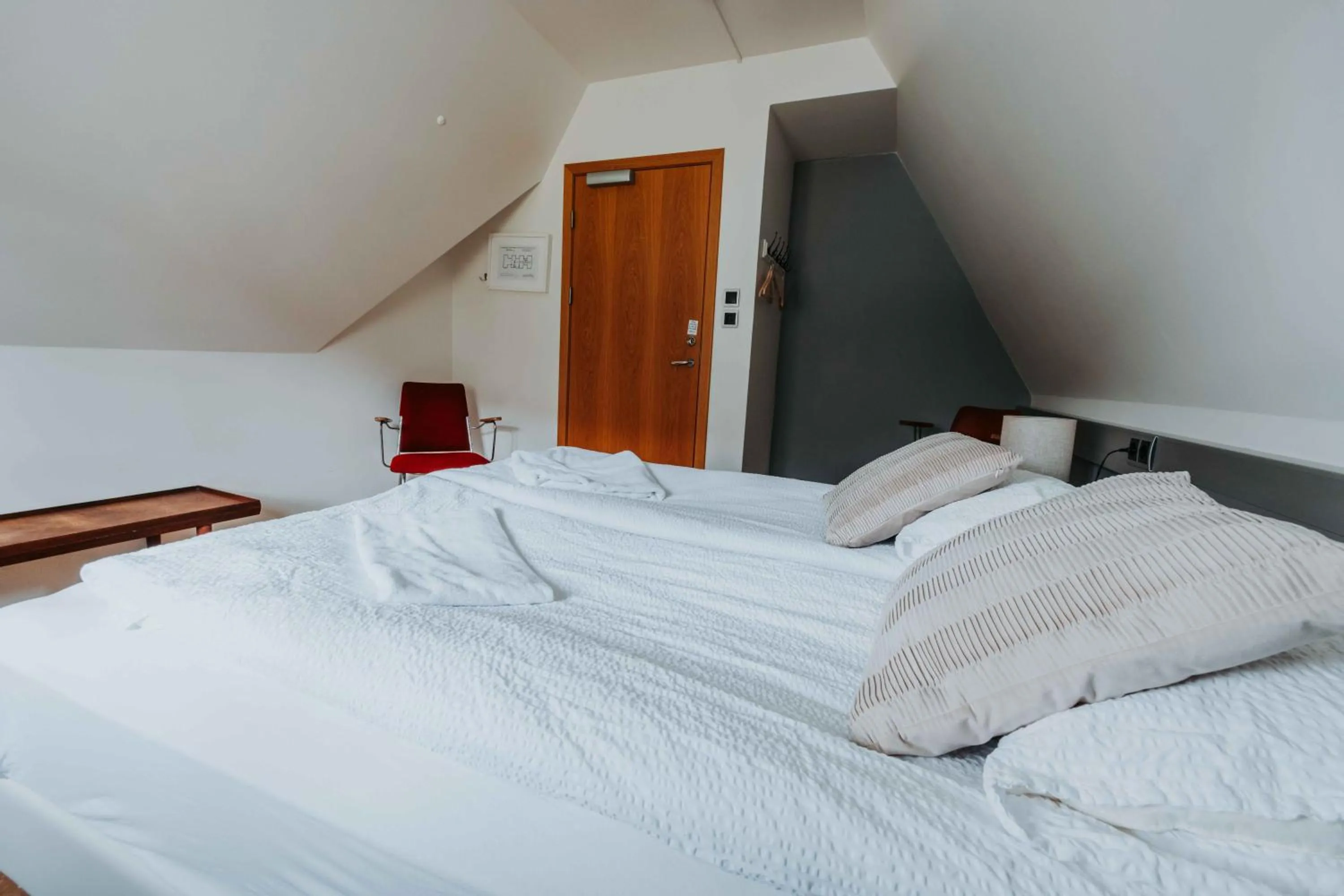 Bed in Héradsskólinn Historic Guesthouse