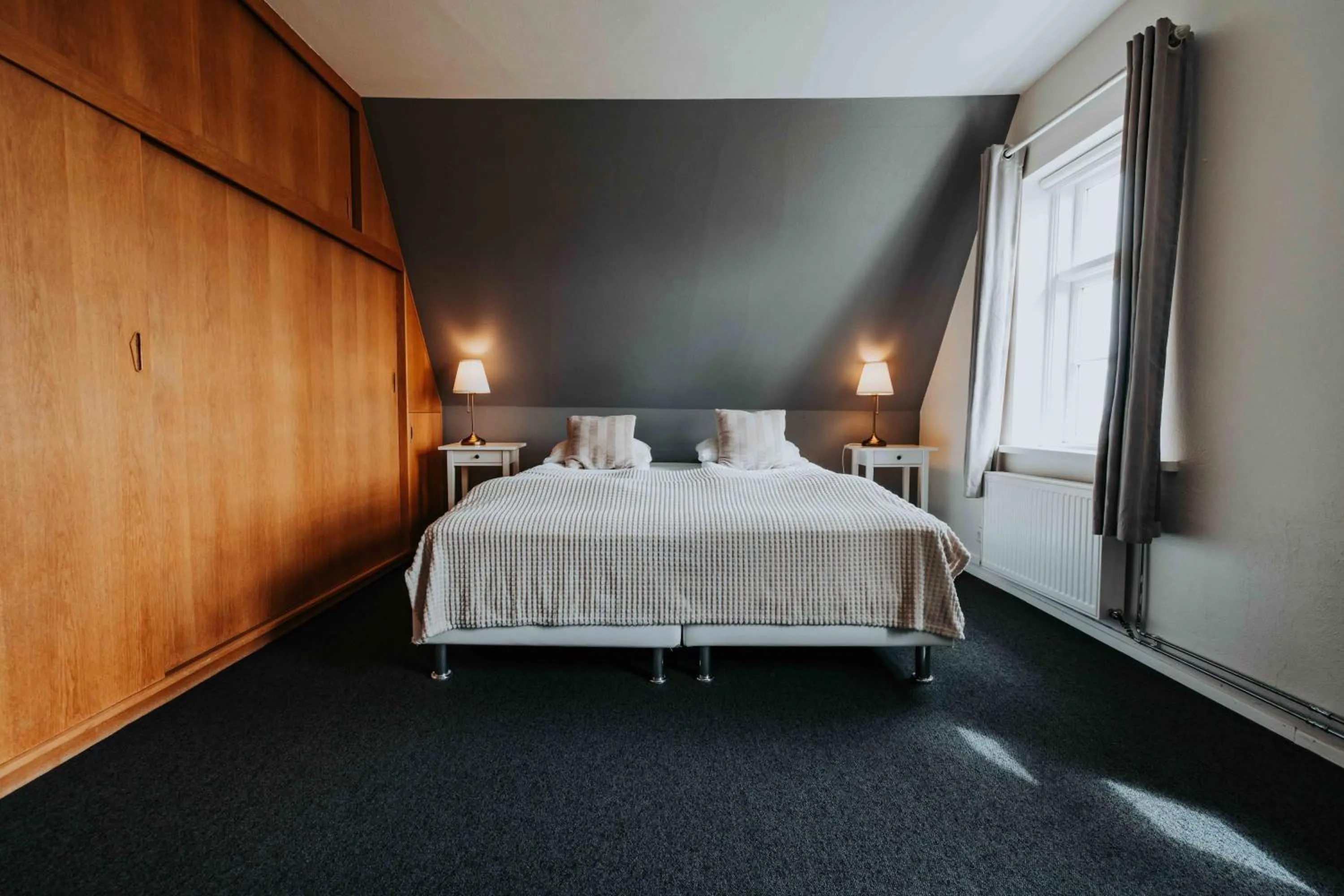 Bed in Héradsskólinn Historic Guesthouse