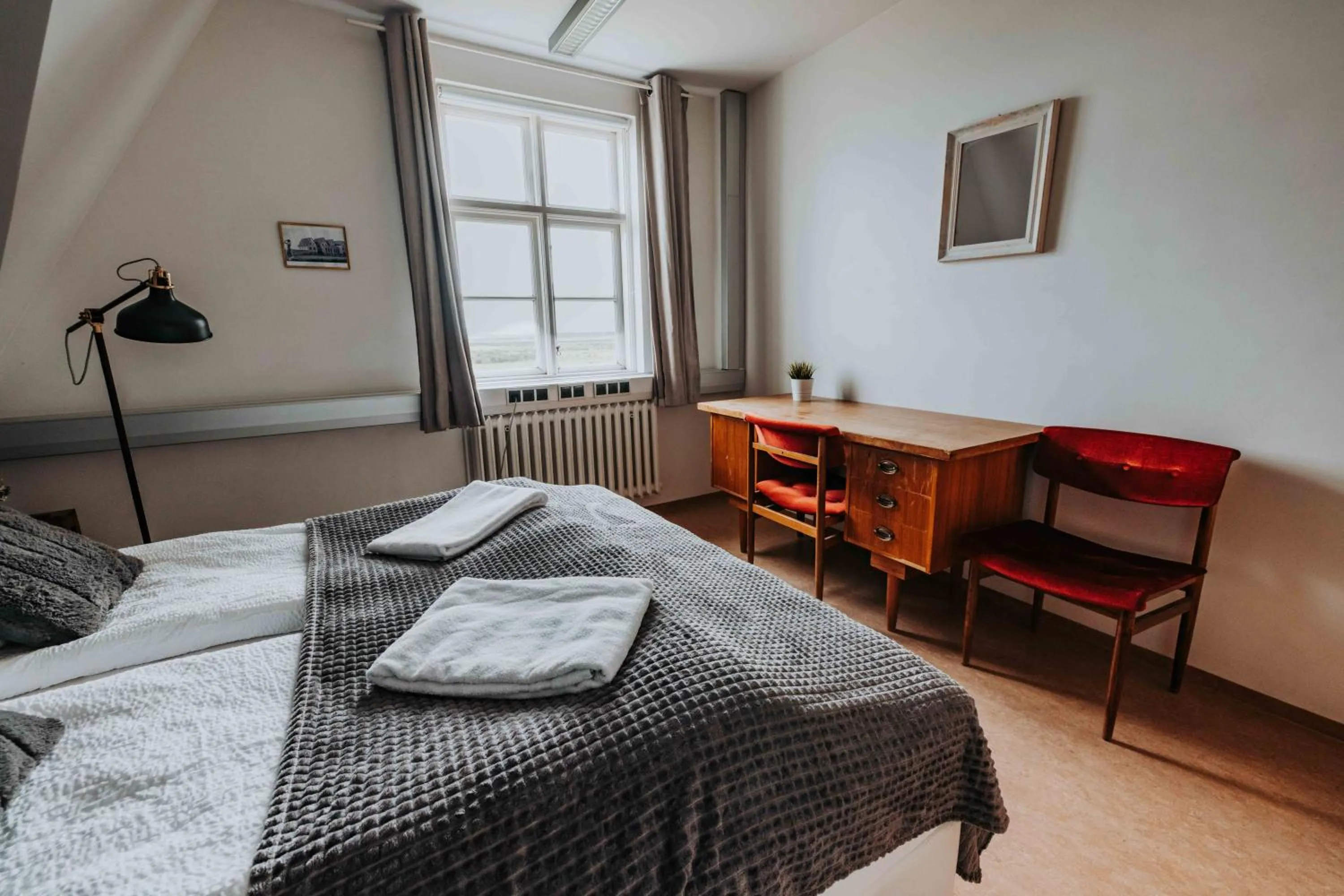 Bed in Héradsskólinn Historic Guesthouse