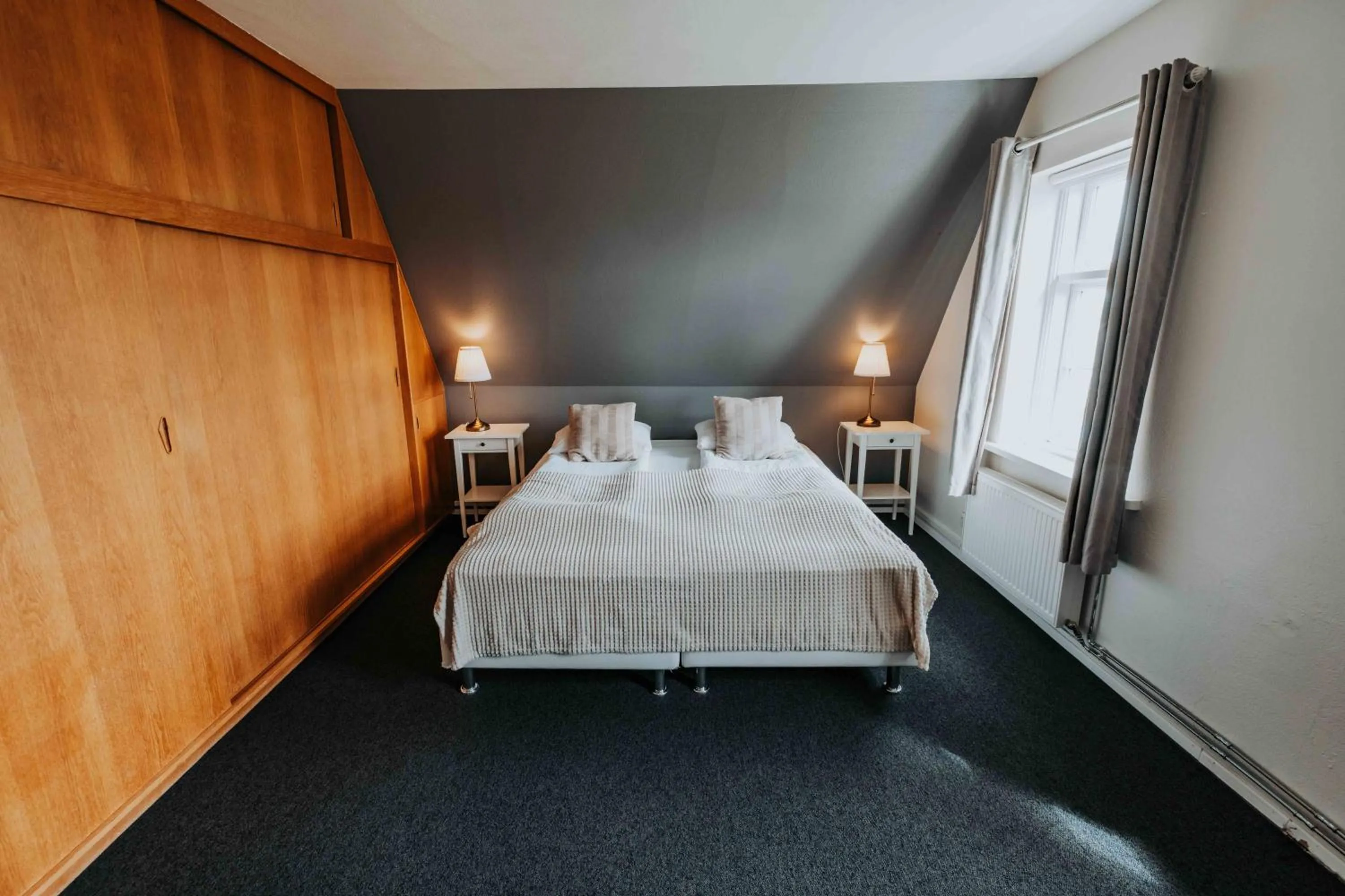 Bed in Héradsskólinn Historic Guesthouse