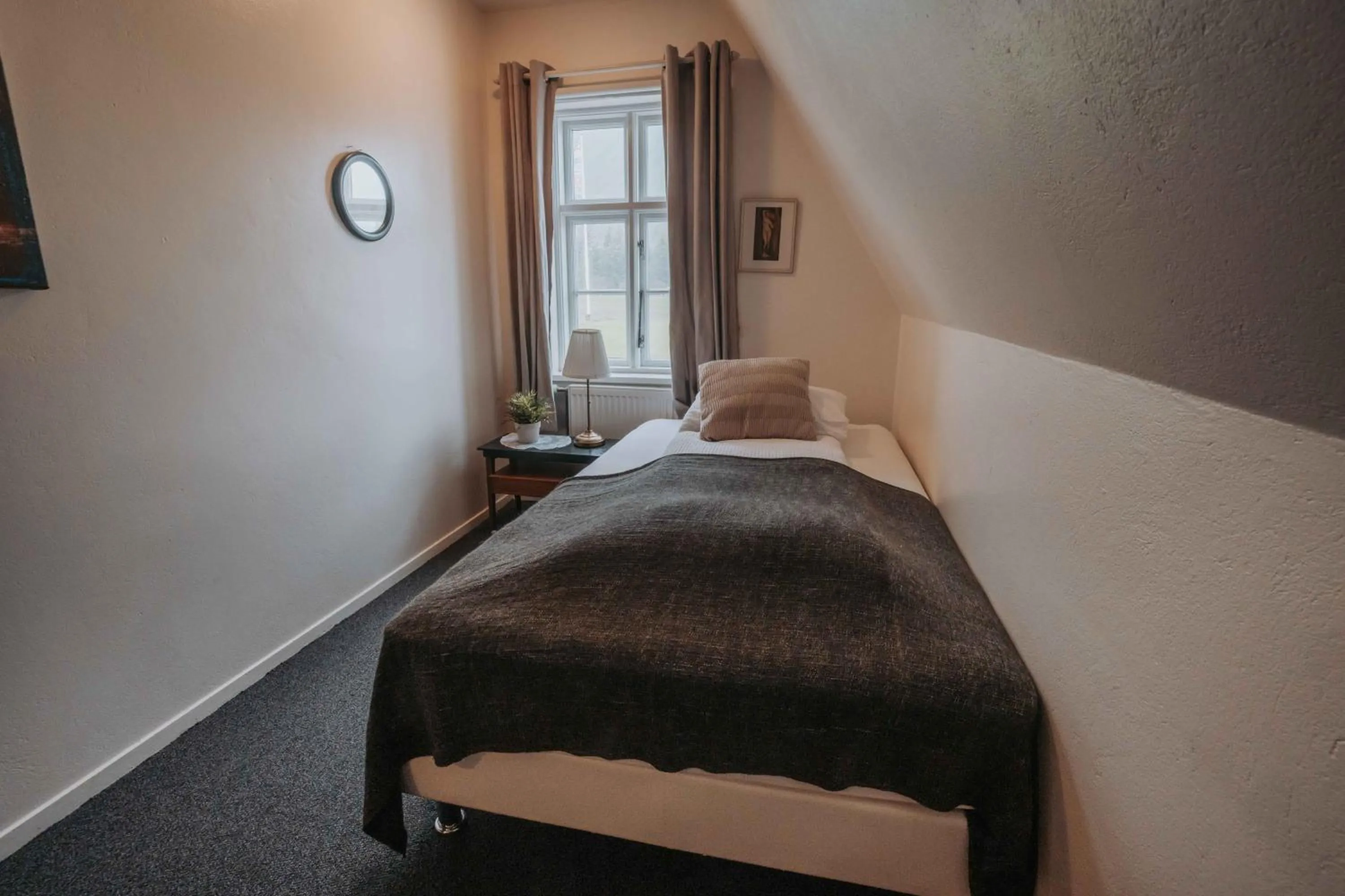 Bed in Héradsskólinn Historic Guesthouse