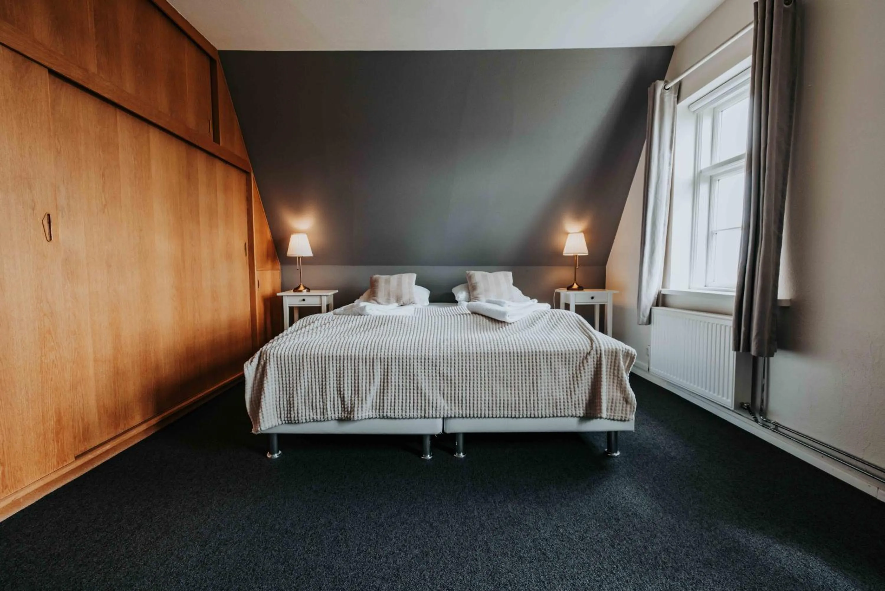 Bed in Héradsskólinn Historic Guesthouse