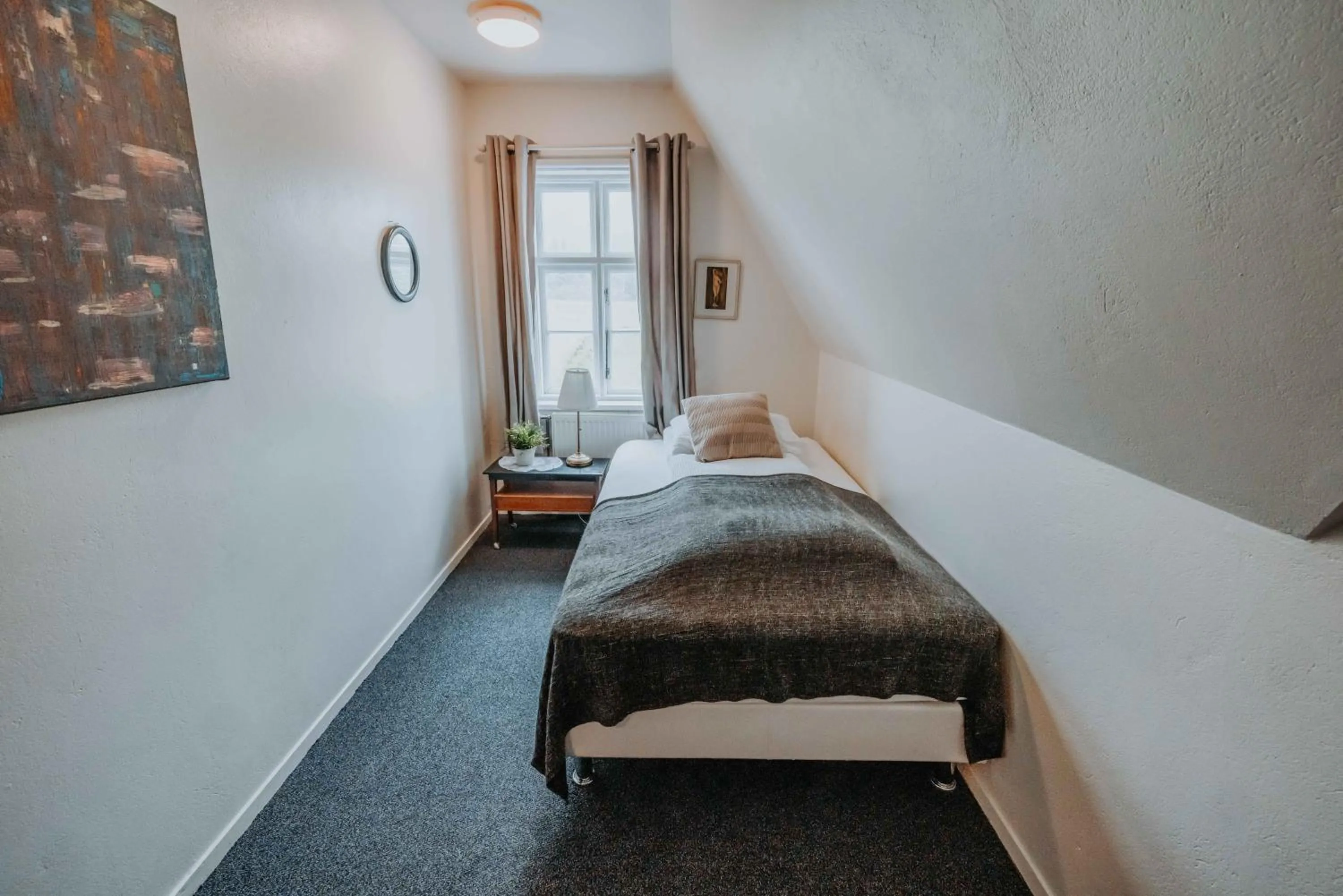 Bed in Héradsskólinn Historic Guesthouse