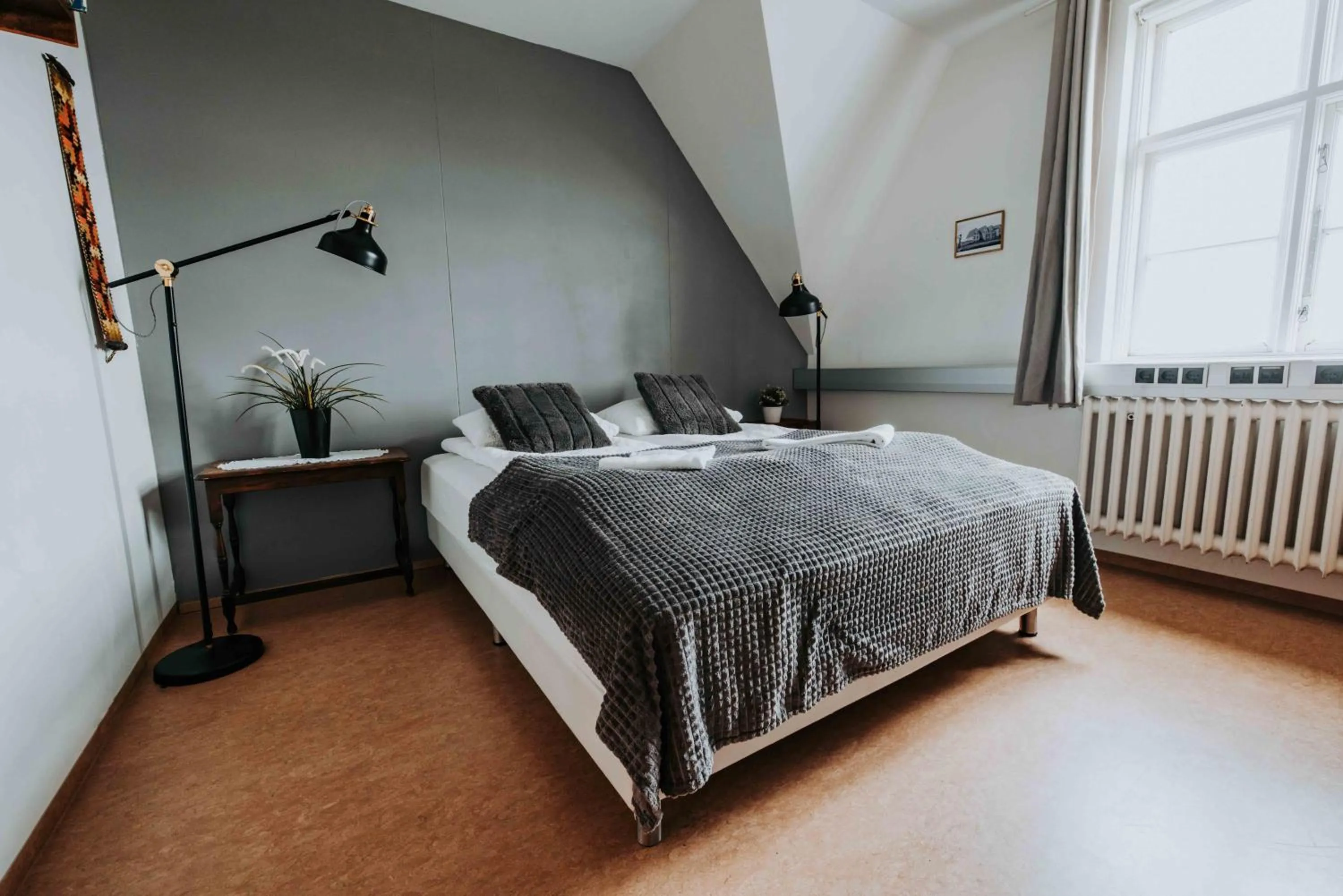 Bed in Héradsskólinn Historic Guesthouse