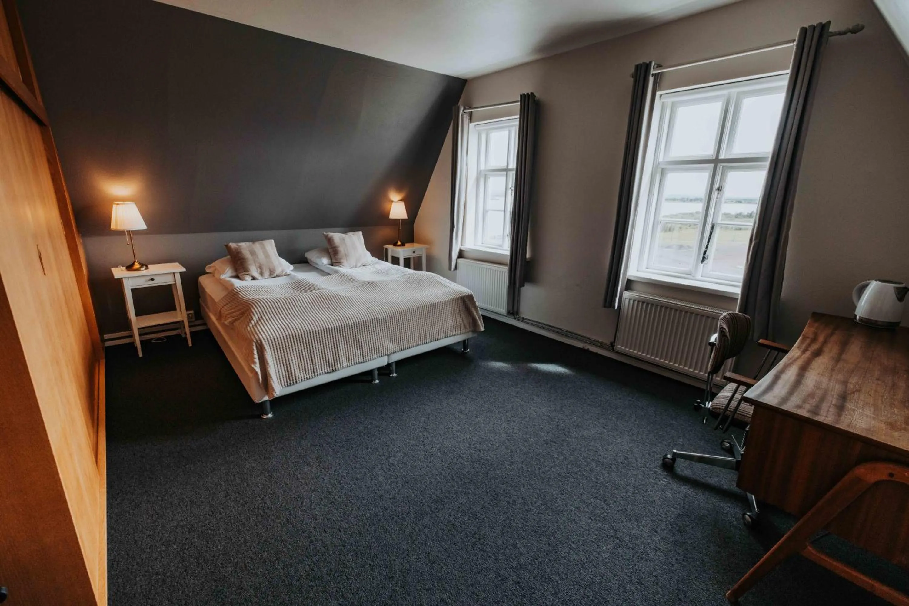 Bed in Héradsskólinn Historic Guesthouse