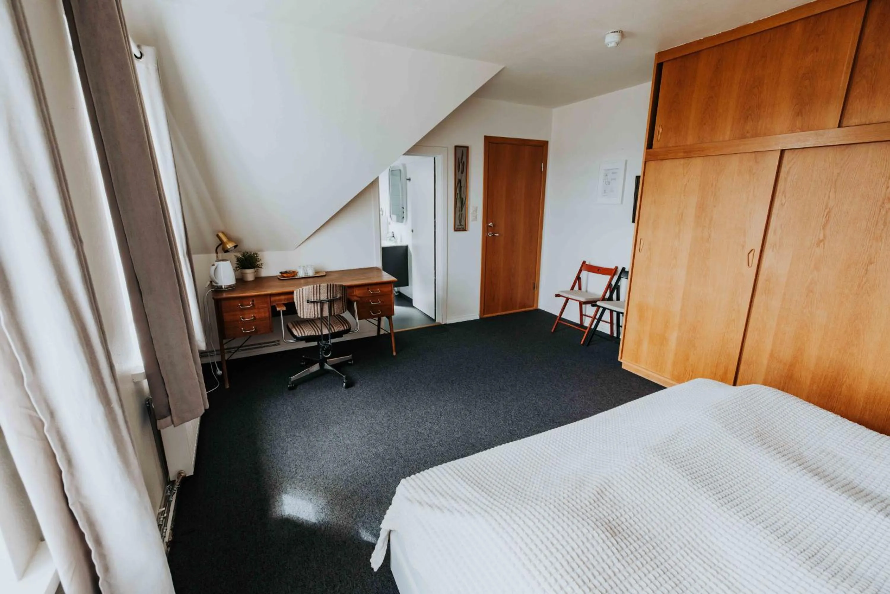 Bed in Héradsskólinn Historic Guesthouse