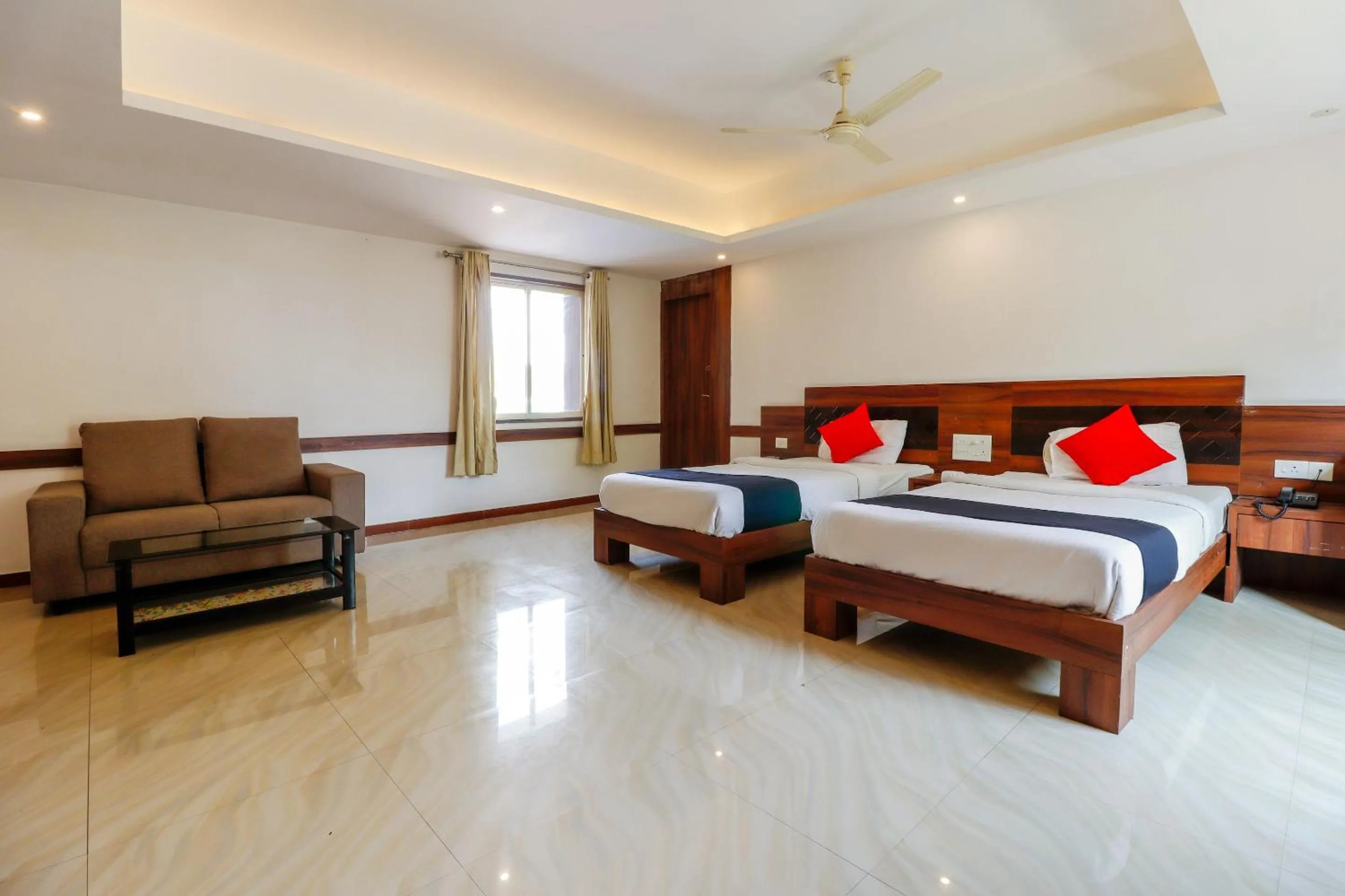 Bedroom, Bed in Capital O Sai Arya Residency