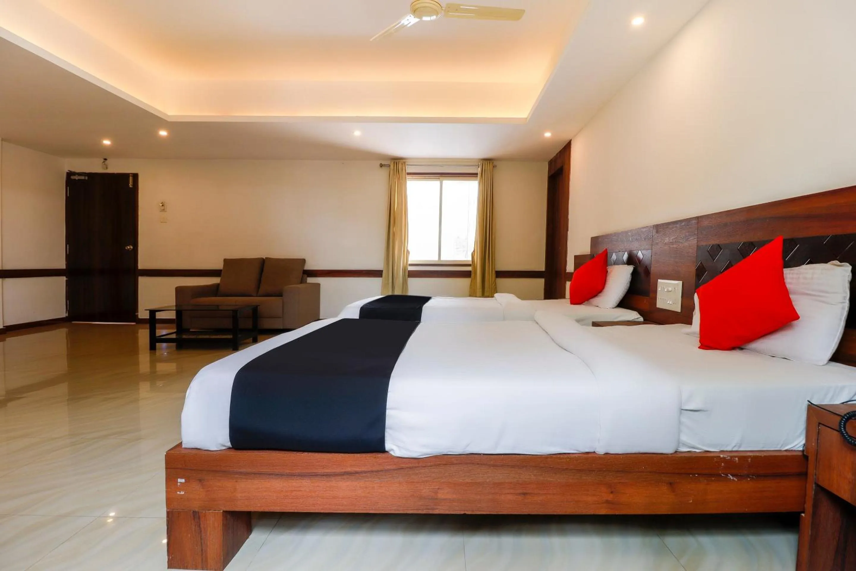 Bedroom, Bed in Capital O Sai Arya Residency