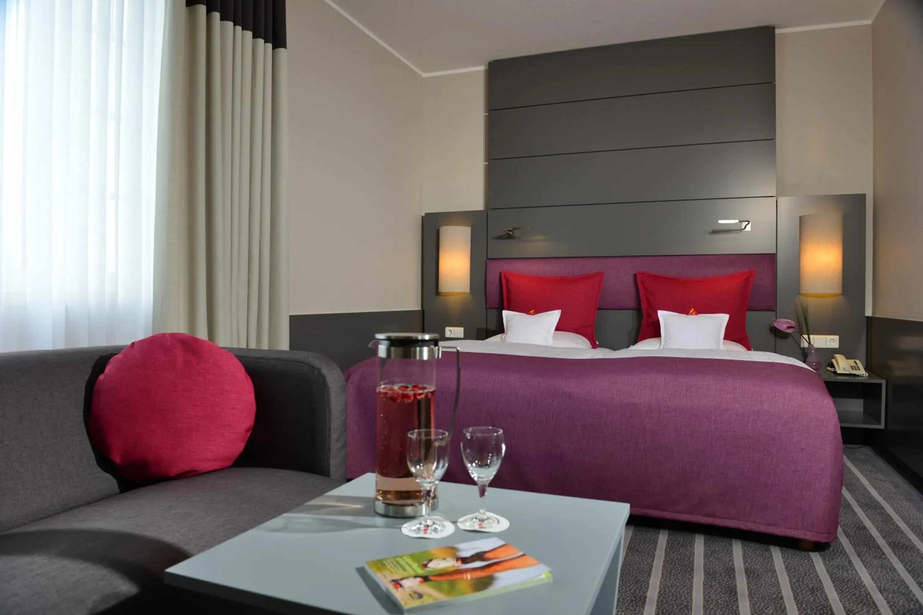 Seating area, Bed in Best Western Premier Parkhotel Kronsberg Seating area, Bed in Best Western Premier Parkhotel Kronsberg